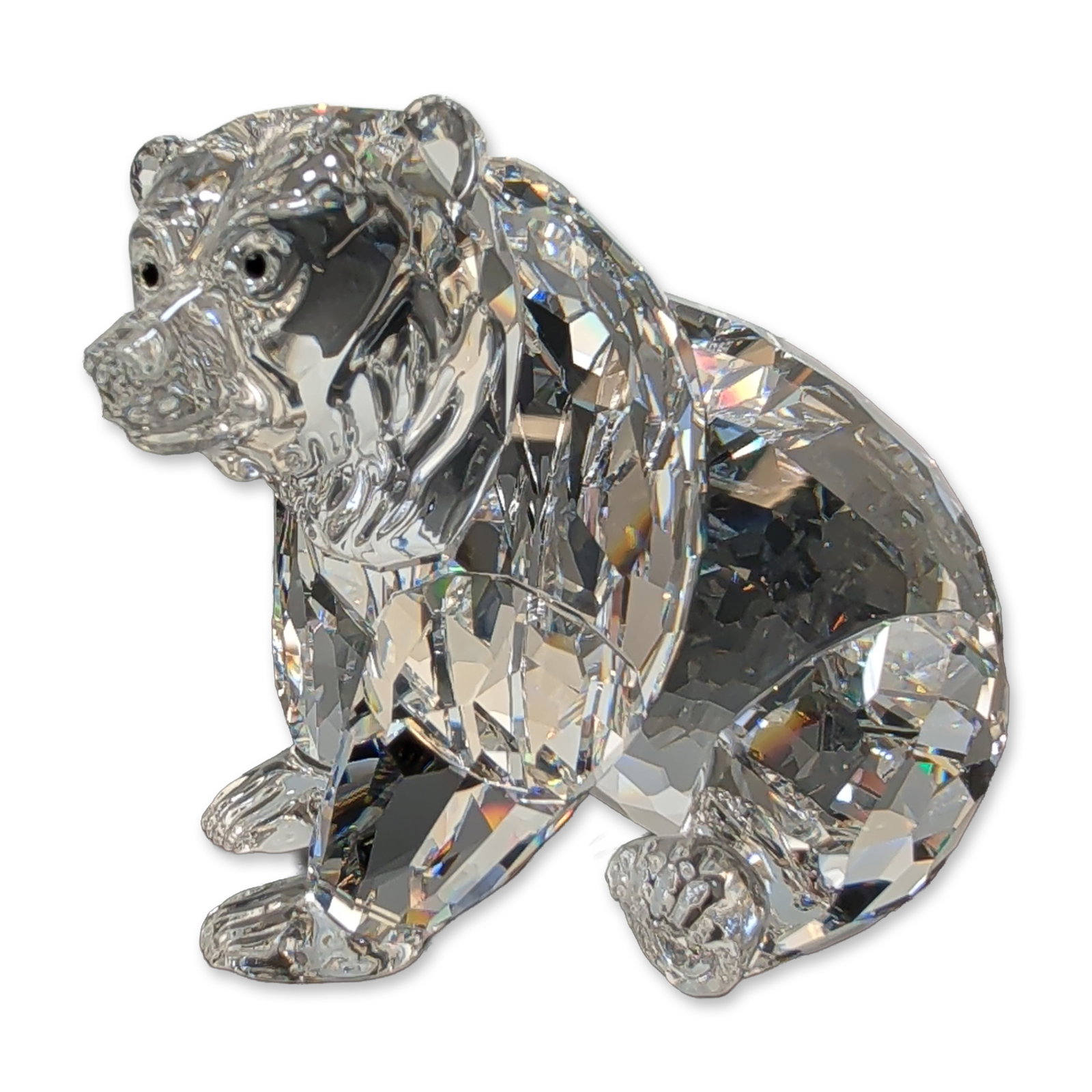 Swarovski Crystal Bear Figurine, Grizzly: Swarovski Grizzly bear figurine in faceted and molded lead crystal, featuring a textured head with black crystal eyes and nose. Part of the Rare Encounters collection. Acid-etched Swarovski swan mark 