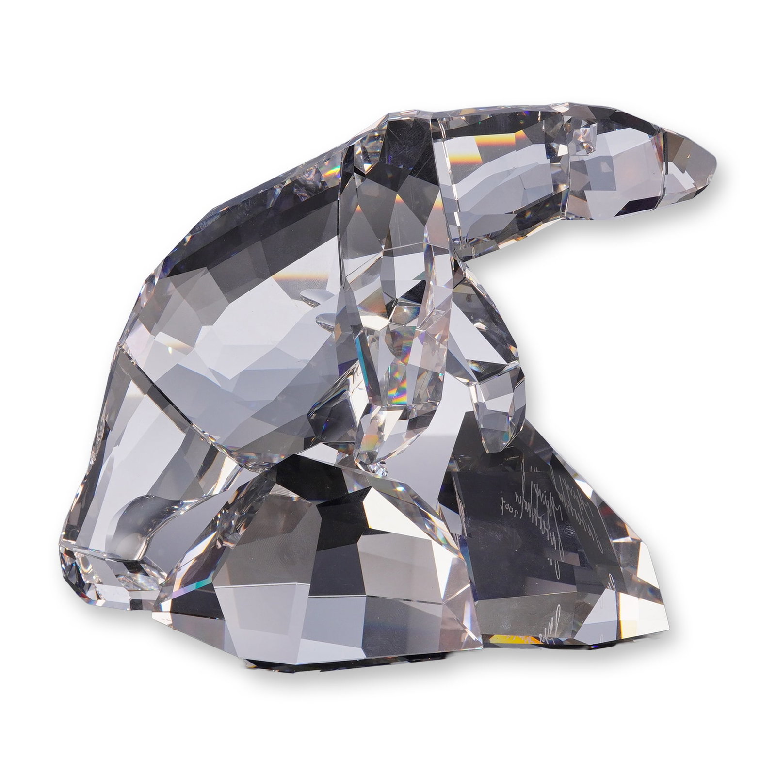 Swarovski Crystal Nanuk Polar Bear Figurine, Signed: Swarovski clear lead crystal figurine titled Nanuk Polar Bear, designed by Heinz Tabertshofer. The faceted clear crystal figure depicts a polar bear standing on an ice-form base with one paw raised. T
