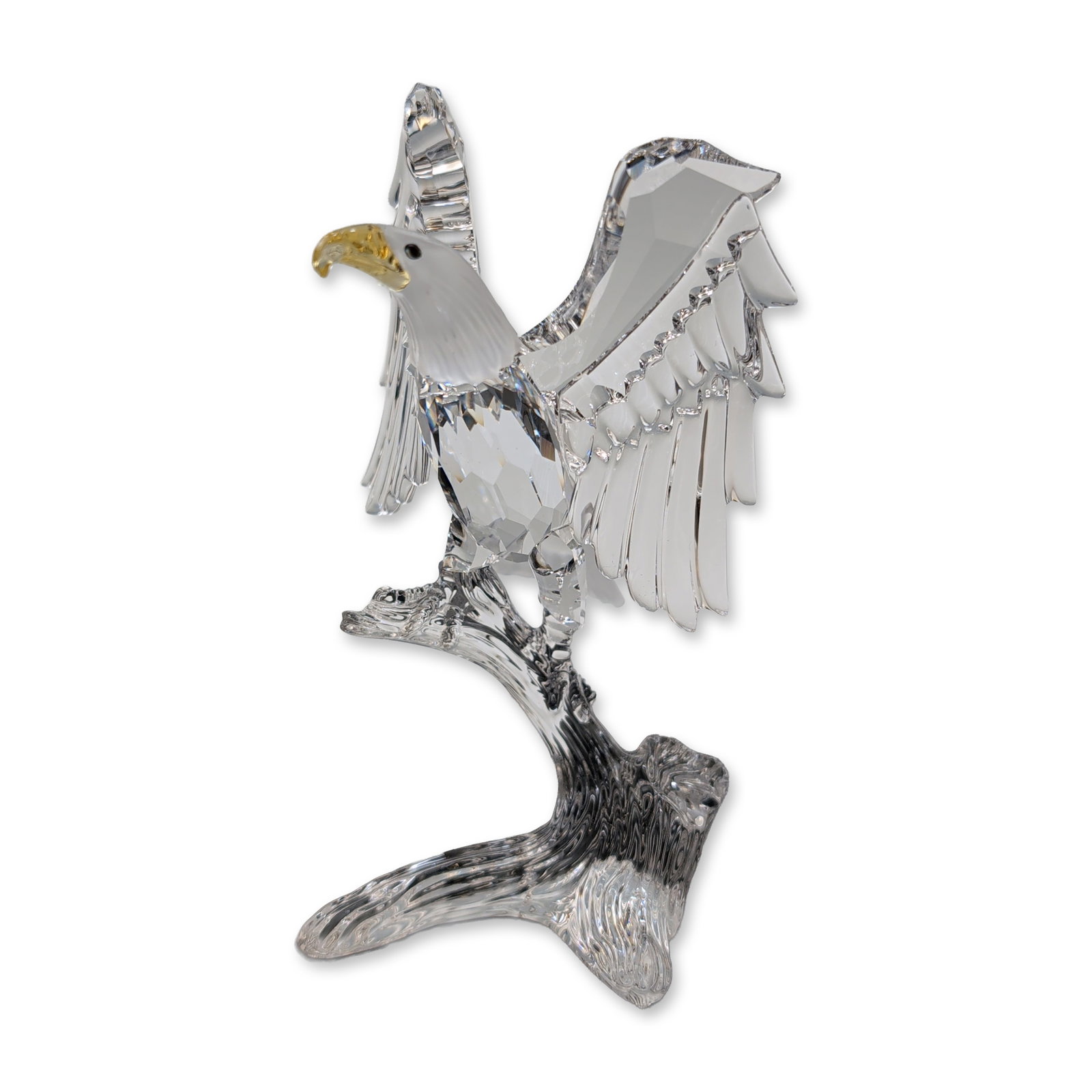 Swarovski Crystal Figurine, Bald Eagle: Swarovski Bald Eagle figurine in faceted and frosted lead crystal, from the Silver Crystal collection. Designed by Adi Stocker, the piece depicts an eagle with outspread wings landing on a textured tr