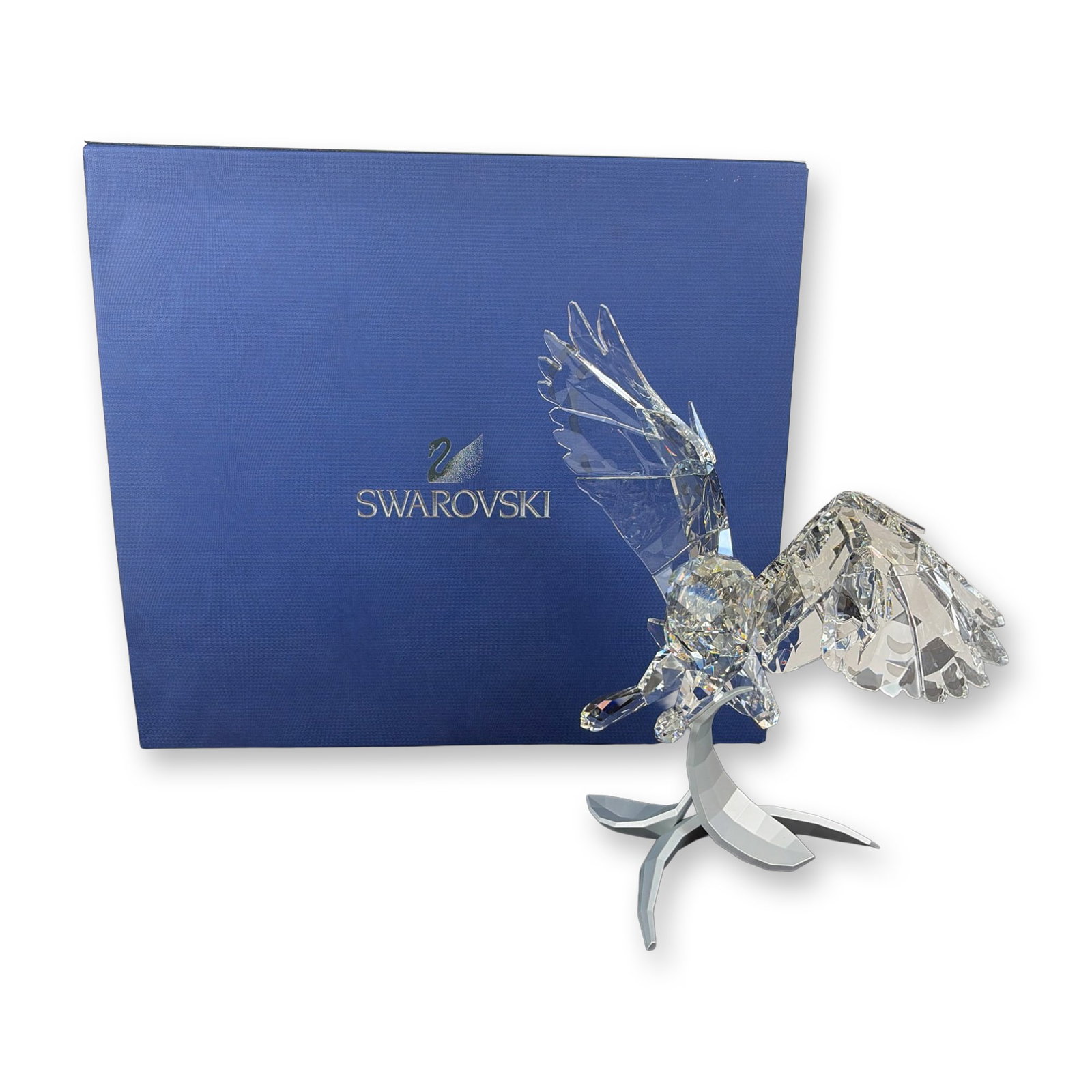 Swarovski Crystal Soulmates Snowy Owl Sculpture: Swarovski Snowy Owl sculpture in clear crystal from the Soulmates series, titled Secret Guardian. Its open wings capture the motion of a real snowy owl, while the metal base adds a touch of majesty. M