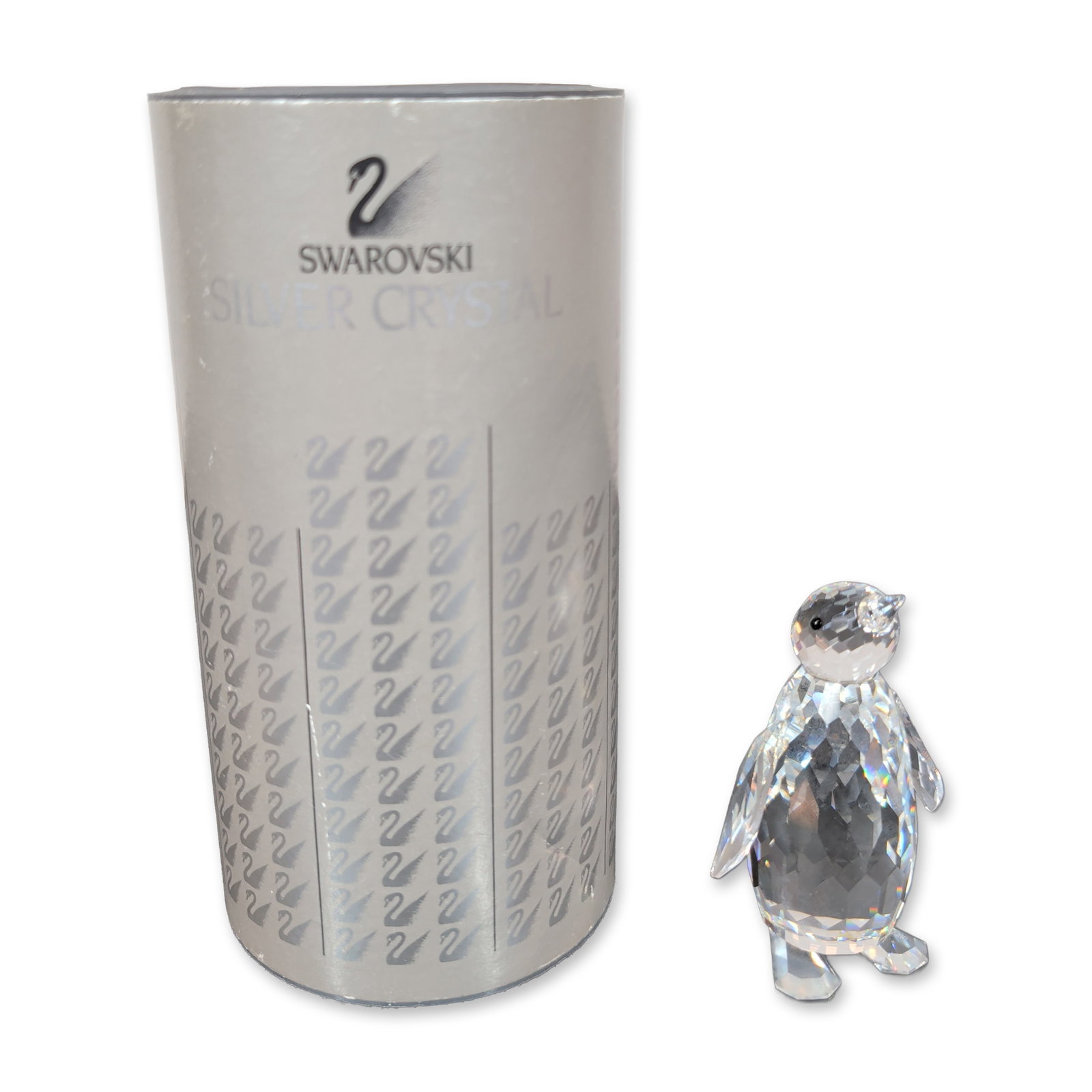 Swarovski Silver Crystal Figurine, Large Penguin: Penguin figurine from the Silver Crystal collection, crafted in faceted lead crystal. The bird features a multi-faceted body and wings with a smooth, rounded head and two inset black crystal eyes. Bas