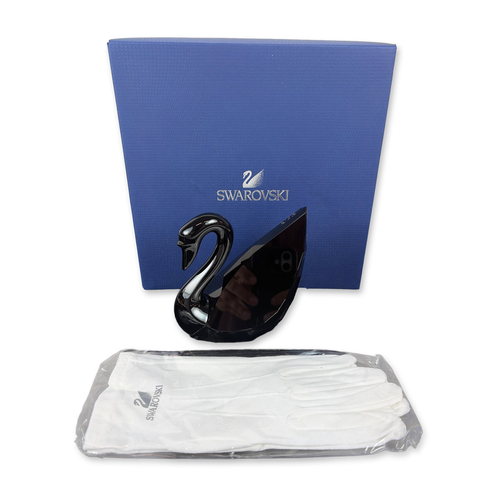Swarovski Soulmates Jet Black Crystal Swan Figurine: Swarovski Swan crafted from black faceted crystal and showcasing a geometric, multi-faceted body with a sleek curved neck. The base bears the Swarovski swan logo and a stylized 2011 signature of desig