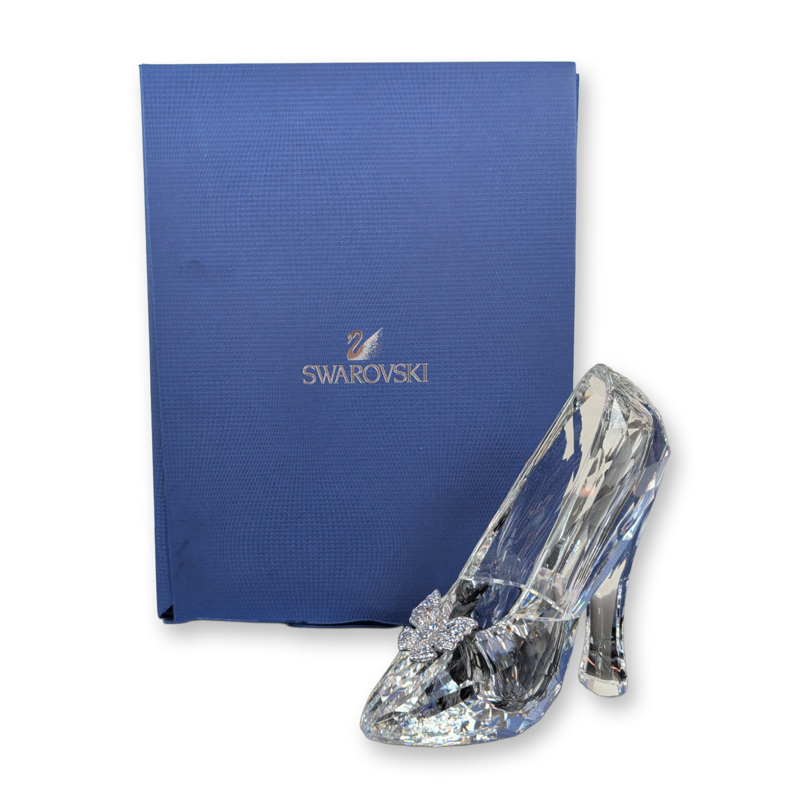 Swarovski Crystal Disney Cinderella Glass Slipper Figurine: This extraordinary creation is inspired by the iconic slipper Swarovski designed for Disney's Cinderella movie. Meticulously crafted with 221 sparkling facets in clear crystal, this 85-percent scale r