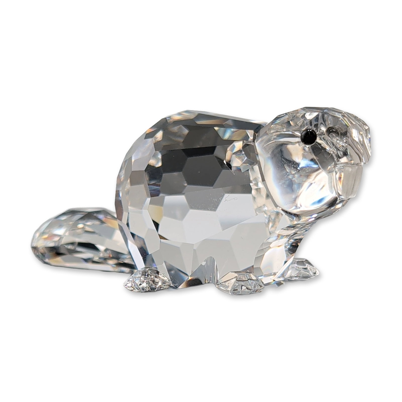 Swarovski Silver Crystal Beaver Mother Figurine: Swarovski lead-faceted crystal figurine from the Silver Crystal collection, featuring a beaver. The beaver is depicted with a rounded faceted body, teardrop-shaped tail, and two black glass bead eyes.