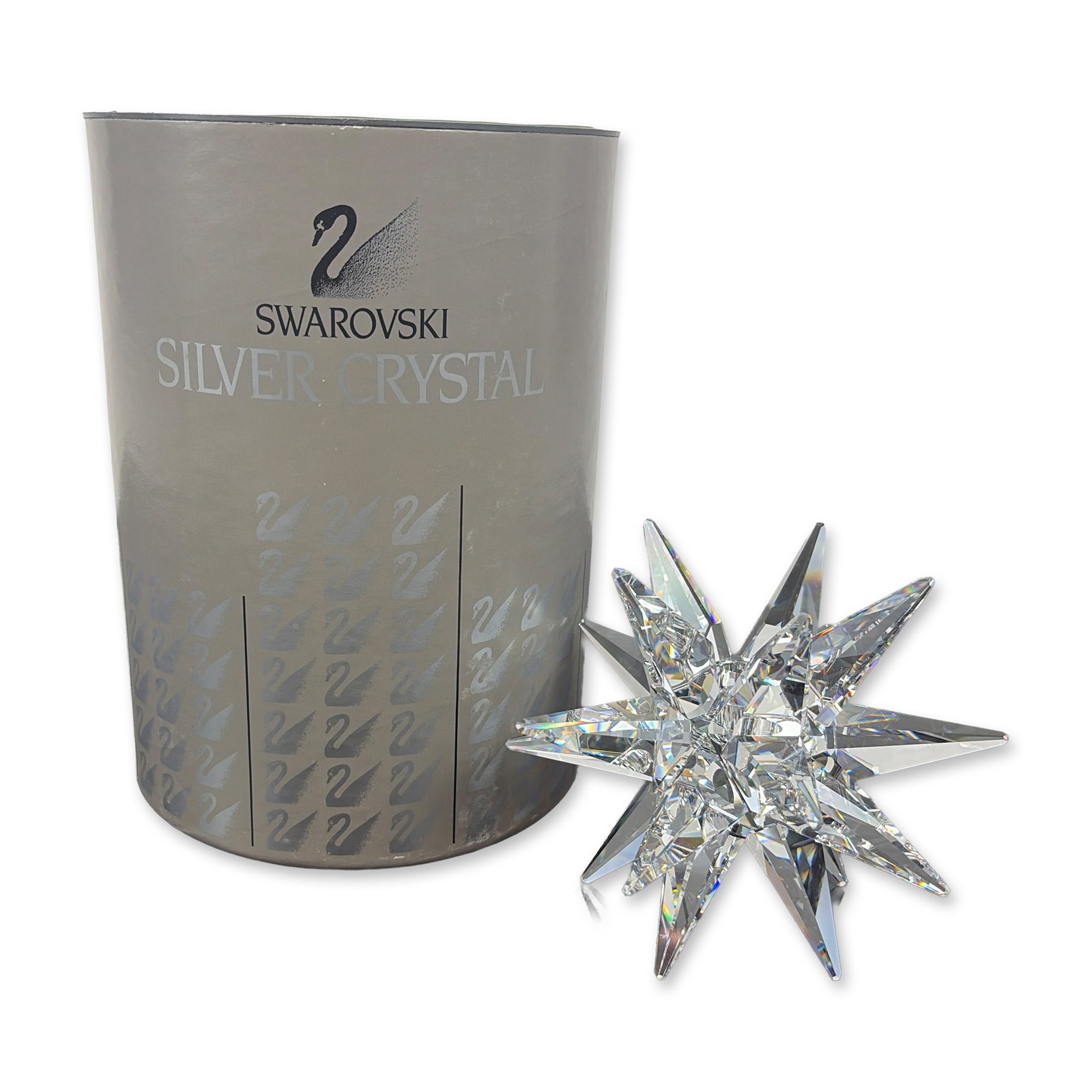Swarovski Austrian Silver Crystal Star Candleholder: Crystal candleholder in the form of a multi-pointed star. Part of the Silver Crystal series, the piece features clear faceted construction designed to refract light, with a central recessed well for a