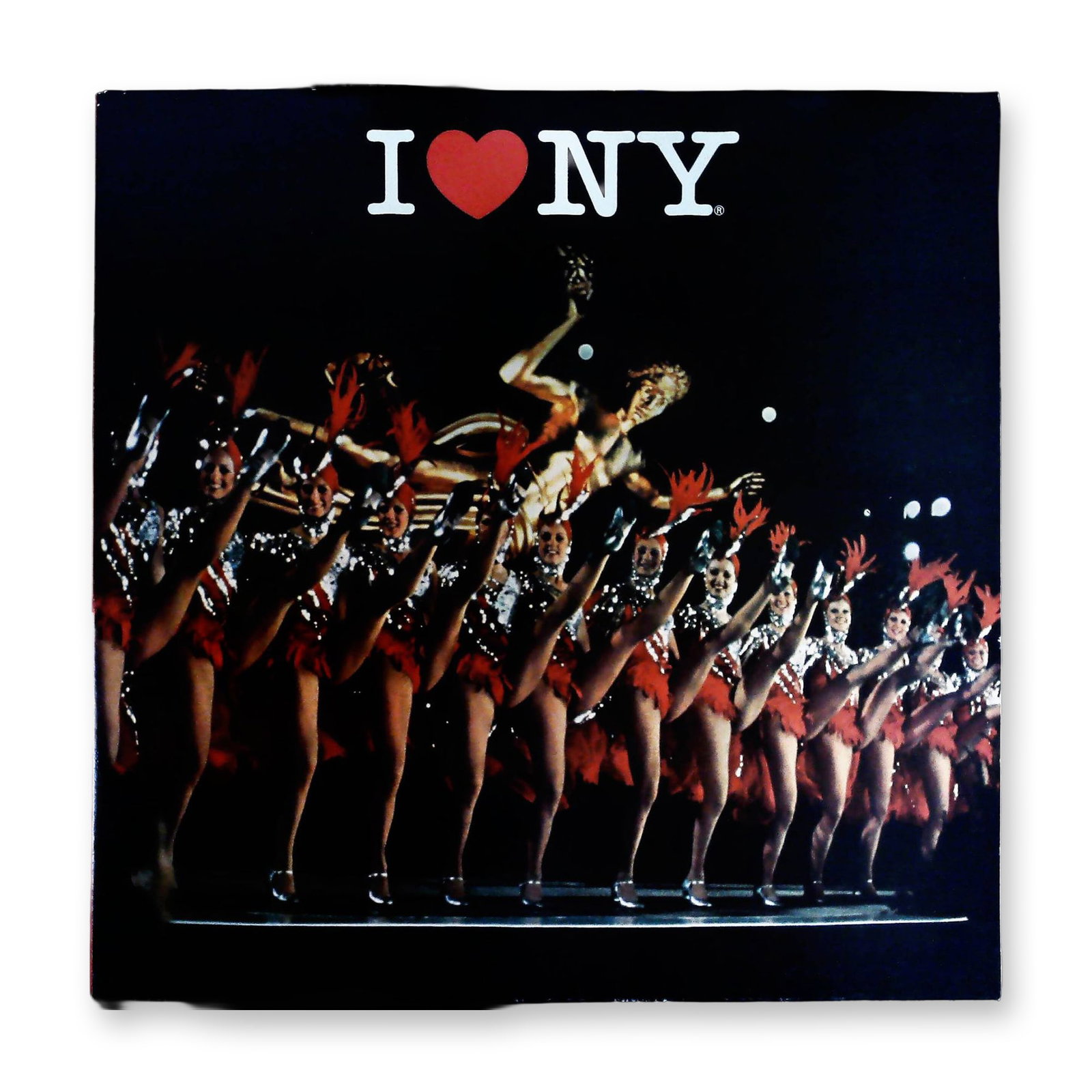 I Love New York Compilation LP featuring Radio City Rockettes Imagery (1977): A vintage vinyl LP record set, "I Love New York," released by CSP (A Service of CBS Records), catalog number P 14853, copyrighted 1977. The compilation features tracks such as "Theme From New York" an