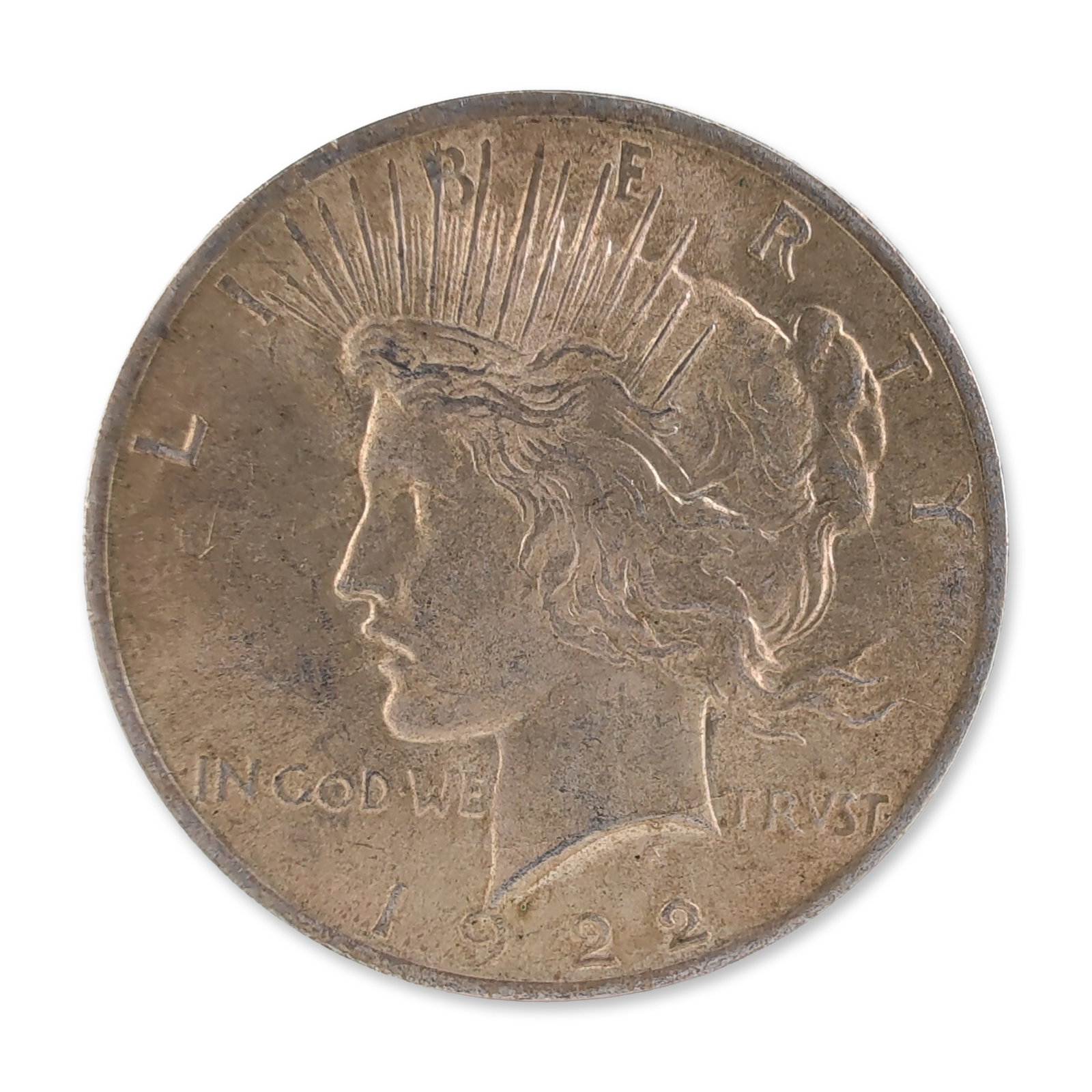 1922 US Peace One Dollar Silver Coin, Circulated: United States 1922 Peace silver dollar, composed of 90 percent silver and 10 percent copper. Designed by Anthony de Francisci, the obverse features a left-facing profile of Liberty wearing a radiate c
