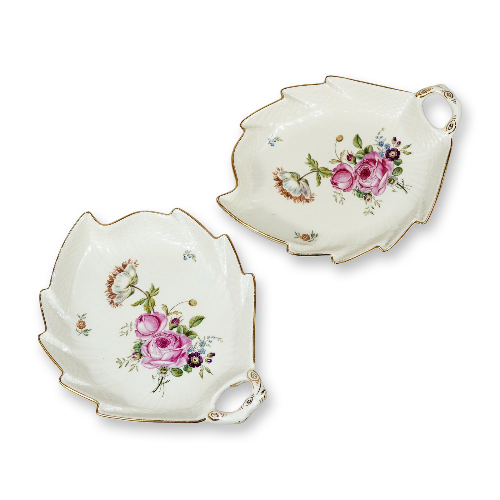 2pc Royal Copenhagen Frijsenborg Porcelain Leaf Dishes: Royal Copenhagen, Denmark. Pair of leaf-shaped dishes in fine porcelain, decorated in the Frijsenborg pattern (No. 910). Each dish features hand-painted polychrome floral sprays, including a central p