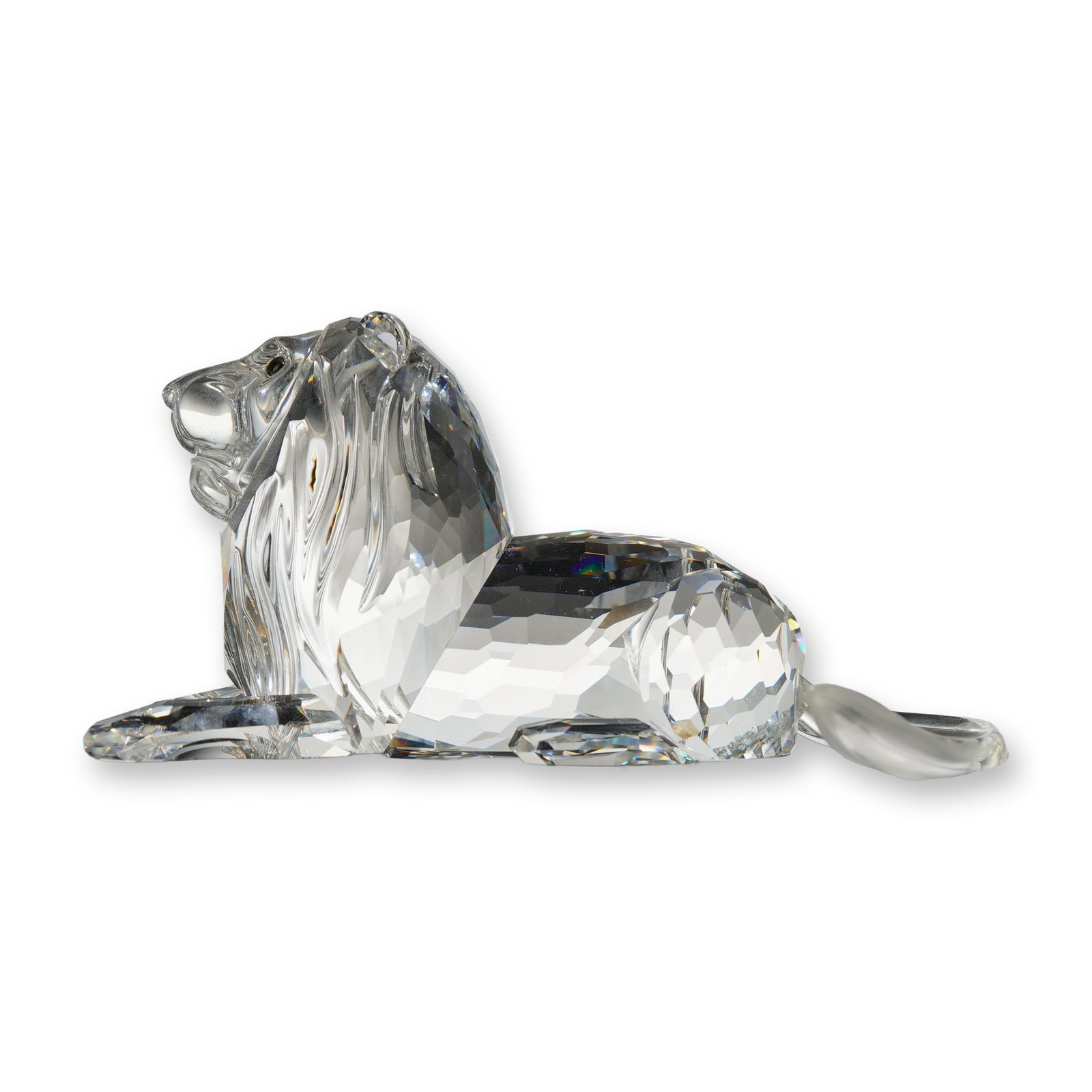 Swarovski SCS 1995 Annual Edition Inspiration Africa, The Lion: Swarovski Crystal Society (SCS) 1995 Annual Edition "The Lion," the inaugural figurine in the "Inspiration Africa" trilogy. Designed by Adi Stocker. This faceted clear lead crystal figurine depicts a 