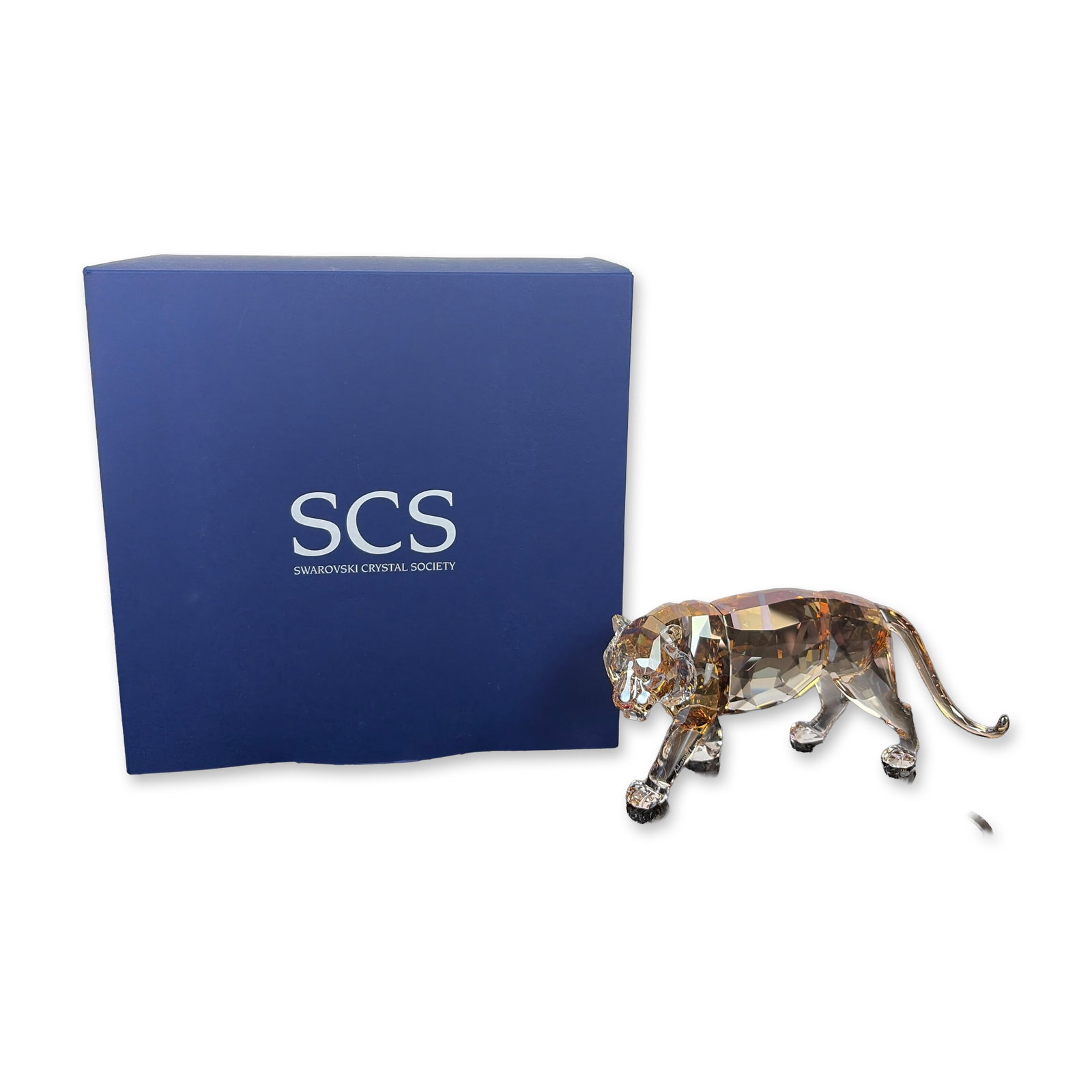 Swarovski SCS 2010 Annual Edition The Tiger w/ Elisabeth Adamer Signed Framed Display: Swarovski faceted lead crystal construction with a golden shine finish, depicting a walking tiger. This piece was designed by Elisabeth Adamer and is the first of the Endangered Wildlife trilogy. The 