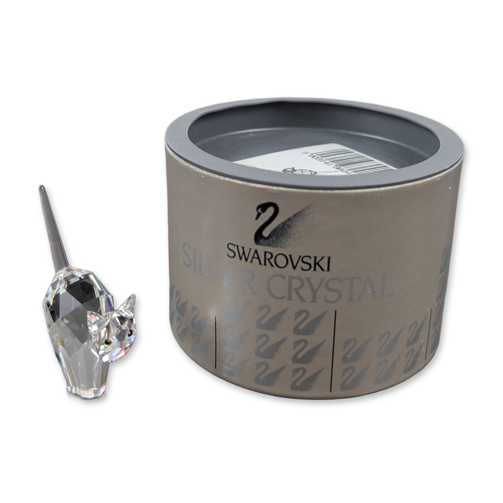 Swarovski Silver Crystal Tomcat Figurine: This striking cat figurine is crafted from clear crystal with piercing black eyes, perched high on a ridge in a fierce, angry stance. The base bears the etched signature of Anton Hirzinger, and it bel