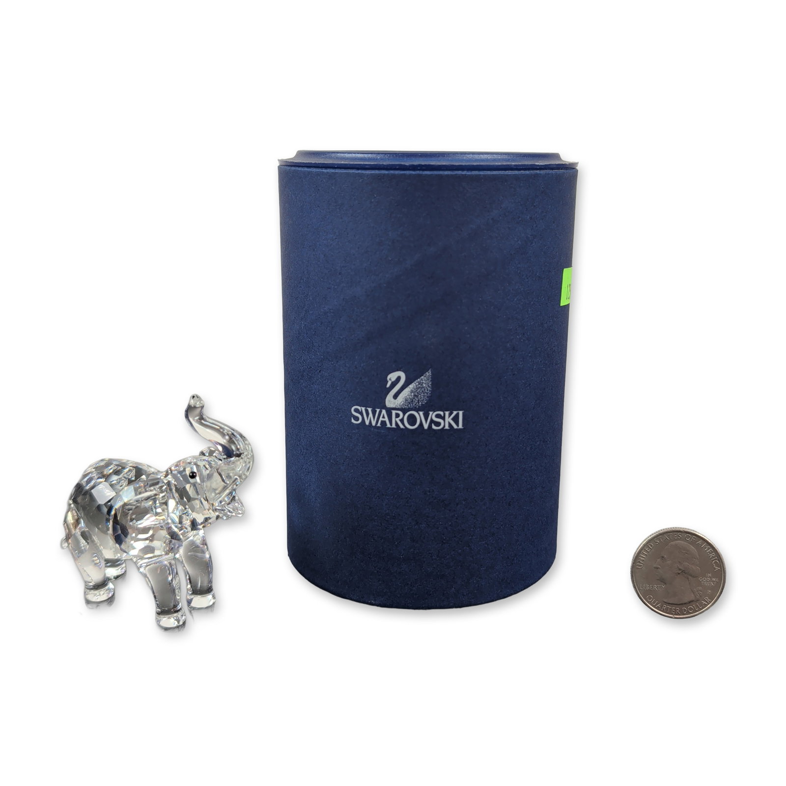 Swarovski Faceted Clear Crystal Baby Elephant Figurine: The Swarovski crystal baby elephant, part of the Rare Encounters theme group, is crafted in faceted clear crystal with charming Jet crystal eyes. Its open mouth and raised trunk give it the look of a 