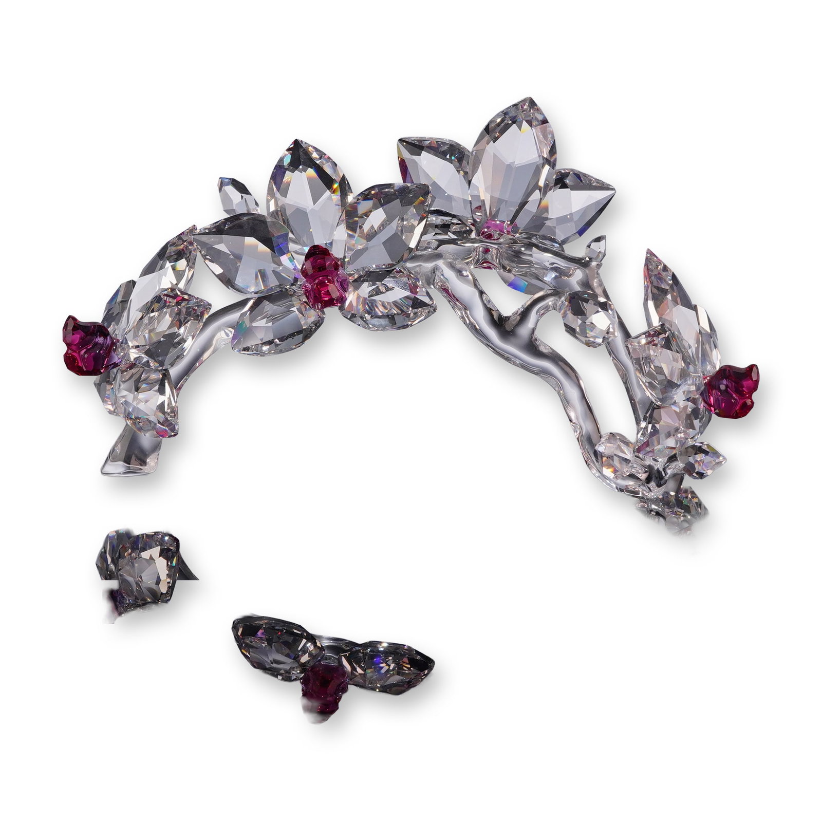 Swarovski Crystal Orchids on a Vine Figurine: The piece features an arched branch constructed of smooth, clear crystal, supporting faceted clear crystal orchid blossoms with fuchsia pink crystal centers. Features an acid-etched Swarovski swan mar