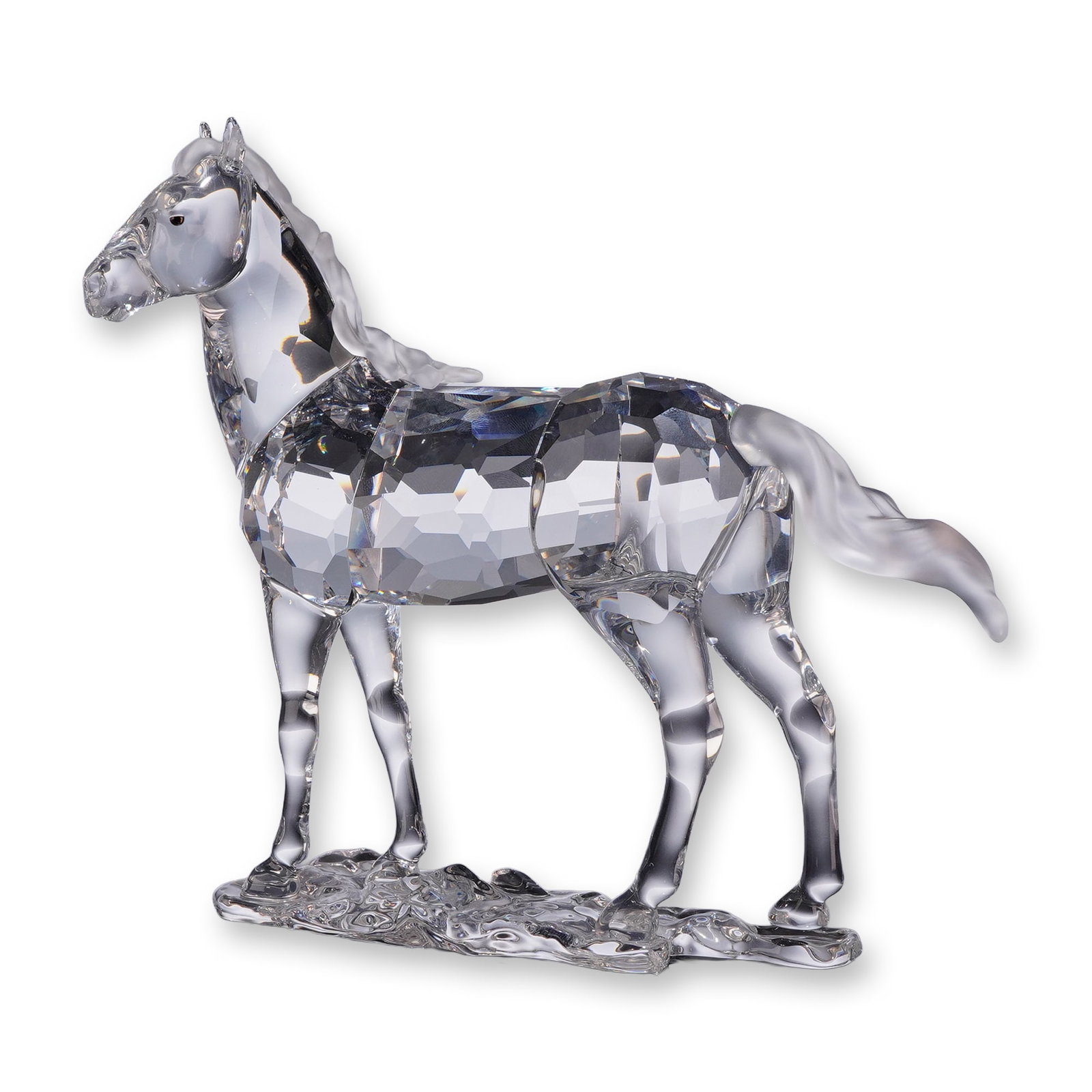 Swarovski Crystal Mare Figurine 860864: Swarovski crystal figurine, Mare 860864. Clear faceted lead crystal body with satin-finished frosted crystal mane and tail. Head detailed with inset dark crystal eyes. The horse stands atop an organic