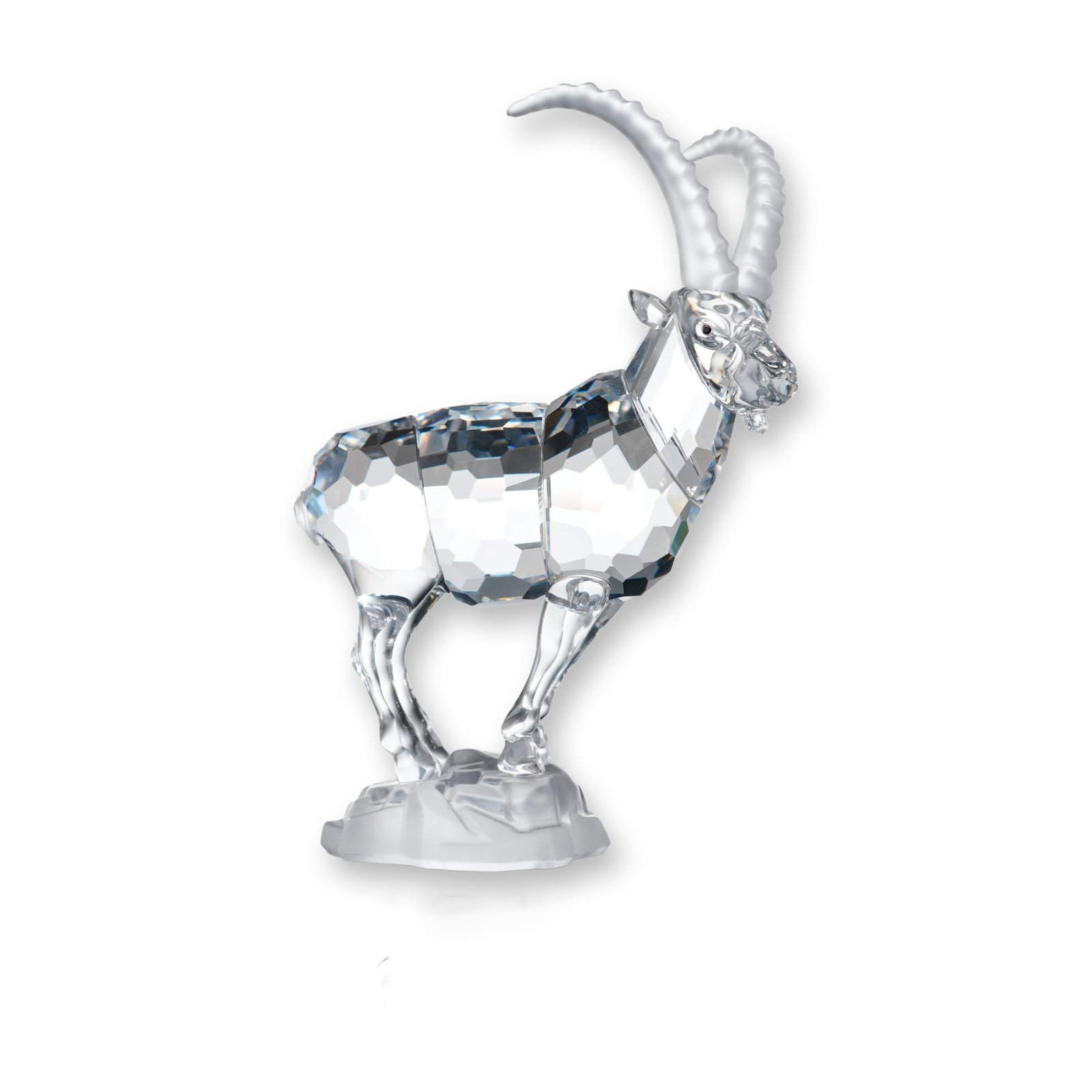 Swarovski Crystal Figurine, Alpine Ibex: Swarovski Austrian crystal Alpine Ibex figurine, featuring a faceted clear crystal body and legs, frosted crystal horns and base, and black crystal eyes. The ibex is depicted standing on a rocky outcr