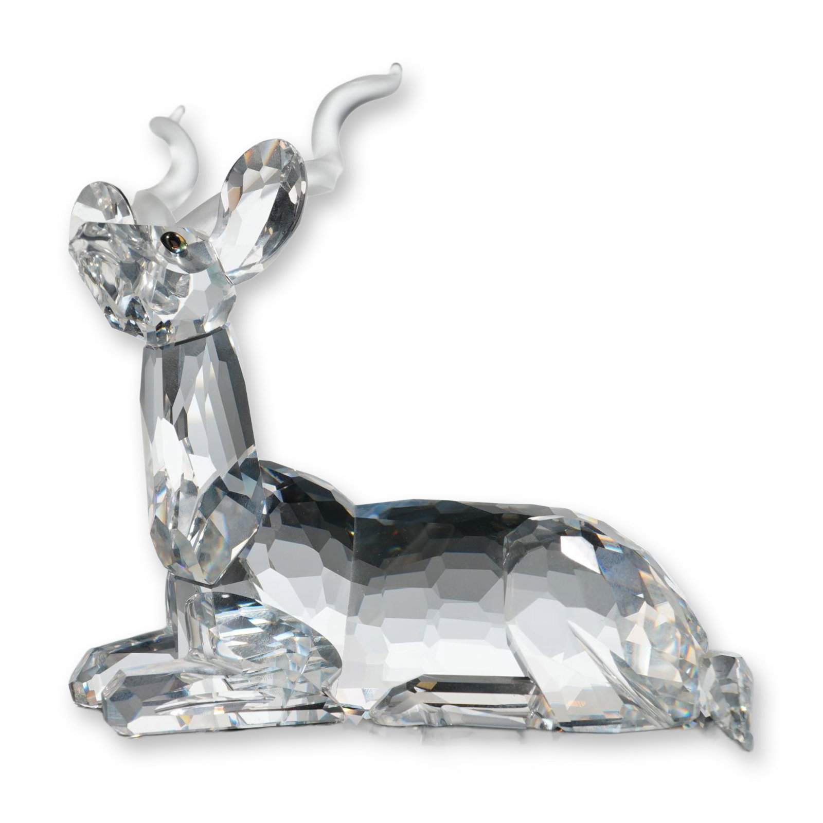 Swarovski 1994 SCS Annual Edition Figurine, Inspiration Africa Kudu: Swarovski Crystal Society (SCS) faceted lead crystal figurine, titled The Kudu, representing the 1994 annual edition from the Inspiration Africa trilogy. The figure is modeled in a reclining pose with