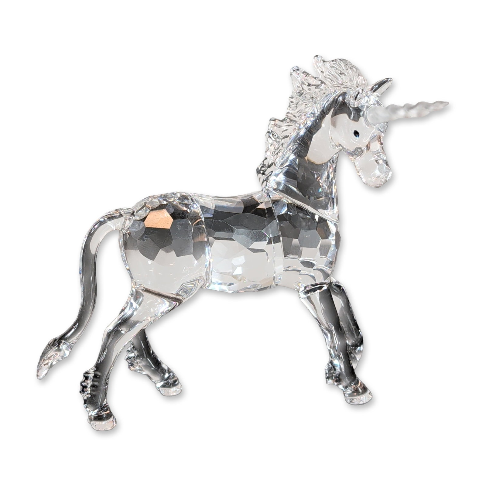 Swarovski Crystal Fables & Tales Figurine, Standing Unicorn: Swarovski faceted lead crystal unicorn figurine, modeled in a dynamic rearing pose. The body is constructed of multi-faceted clear crystal, complemented by a molded and textured mane and tail. Feature