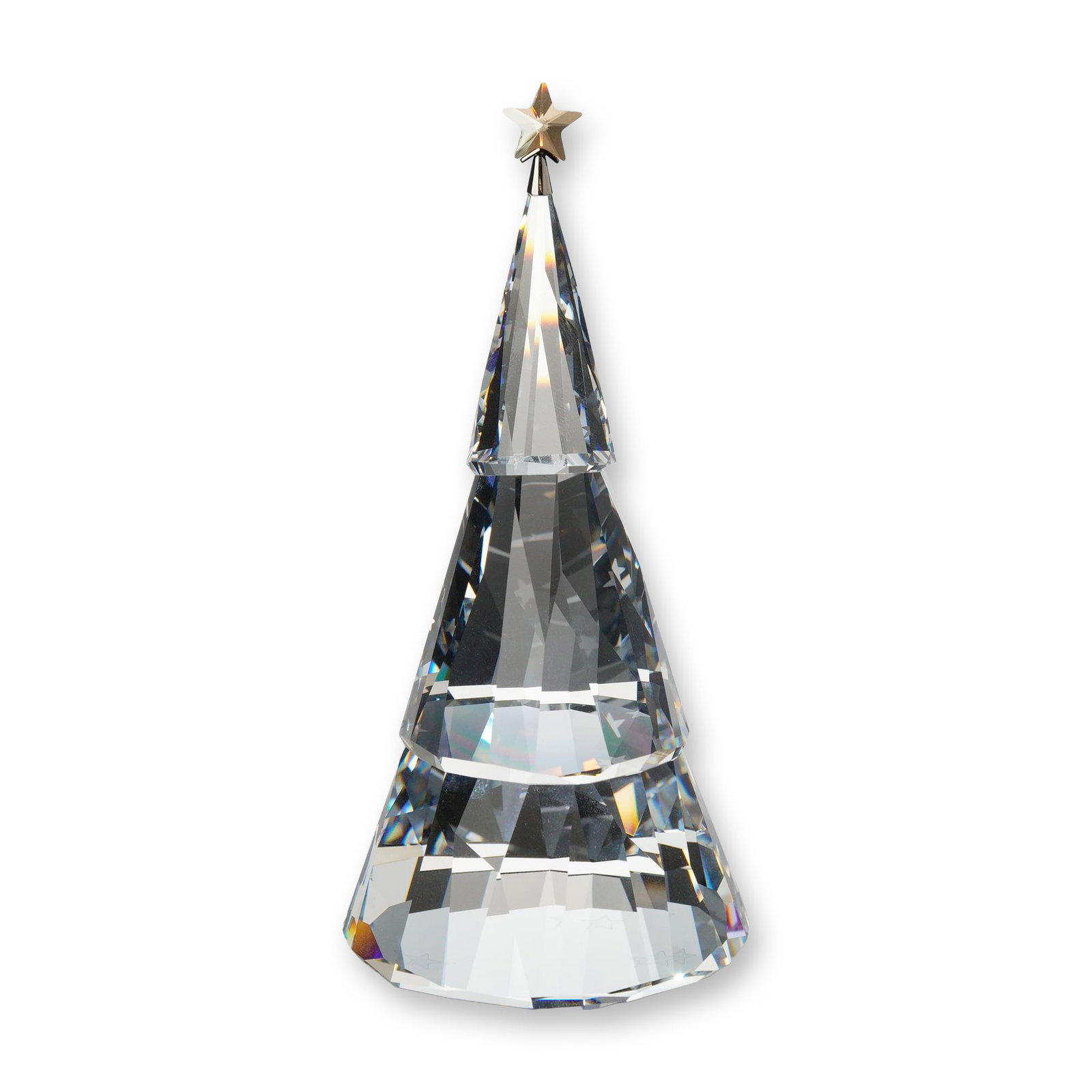 Swarovski Crystal Magical Christmas Tree Figurine: Swarovski. Magical Christmas Tree figurine in clear faceted crystal, featuring a three-tiered conical form topped with a faceted golden-tone crystal star. The underside of the base is decorated with m