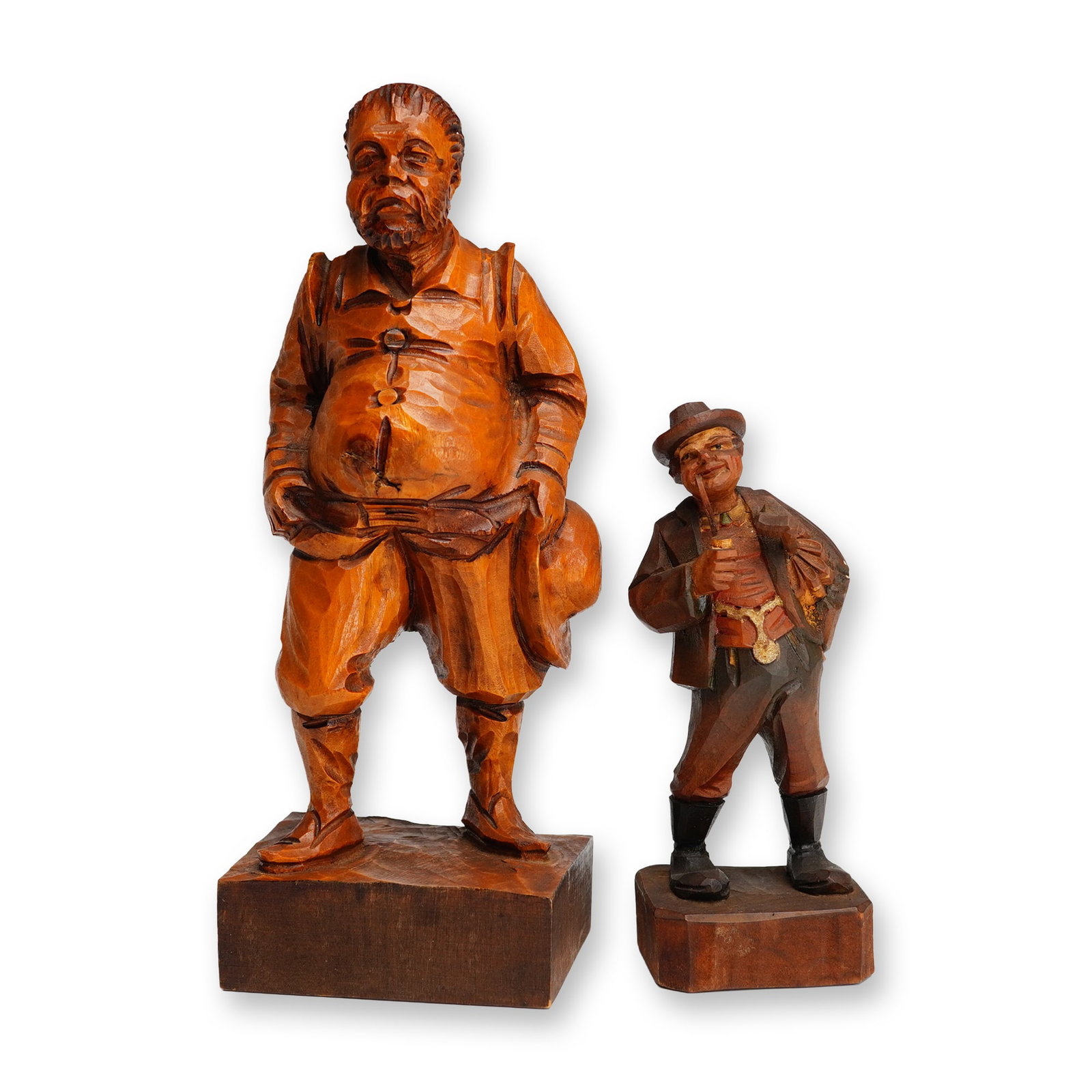 Pair of Hand-Carved Wood Figurines, Sancho Panza & Pickwick: This pair of mid-20th-century hand-carved wooden figurines represents traditional European folk art traditions. The larger figure is a depiction of Sancho Panza, the famous squire from Miguel de Cerva