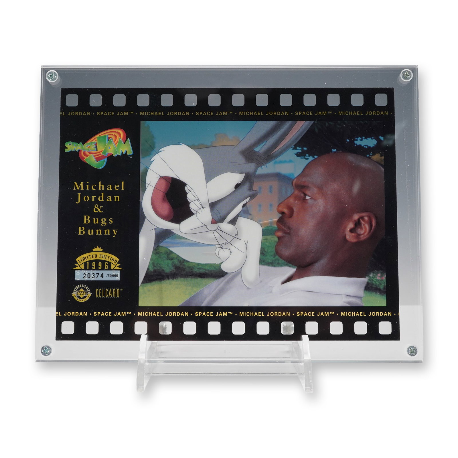 Upper Deck 1996 Space Jam CelCard: Upper Deck, 1996. Official Space Jam CelCard featuring Michael Jordan and Bugs Bunny, constructed from a translucent printed acetate layer set within a black film-strip style border. Front displays th