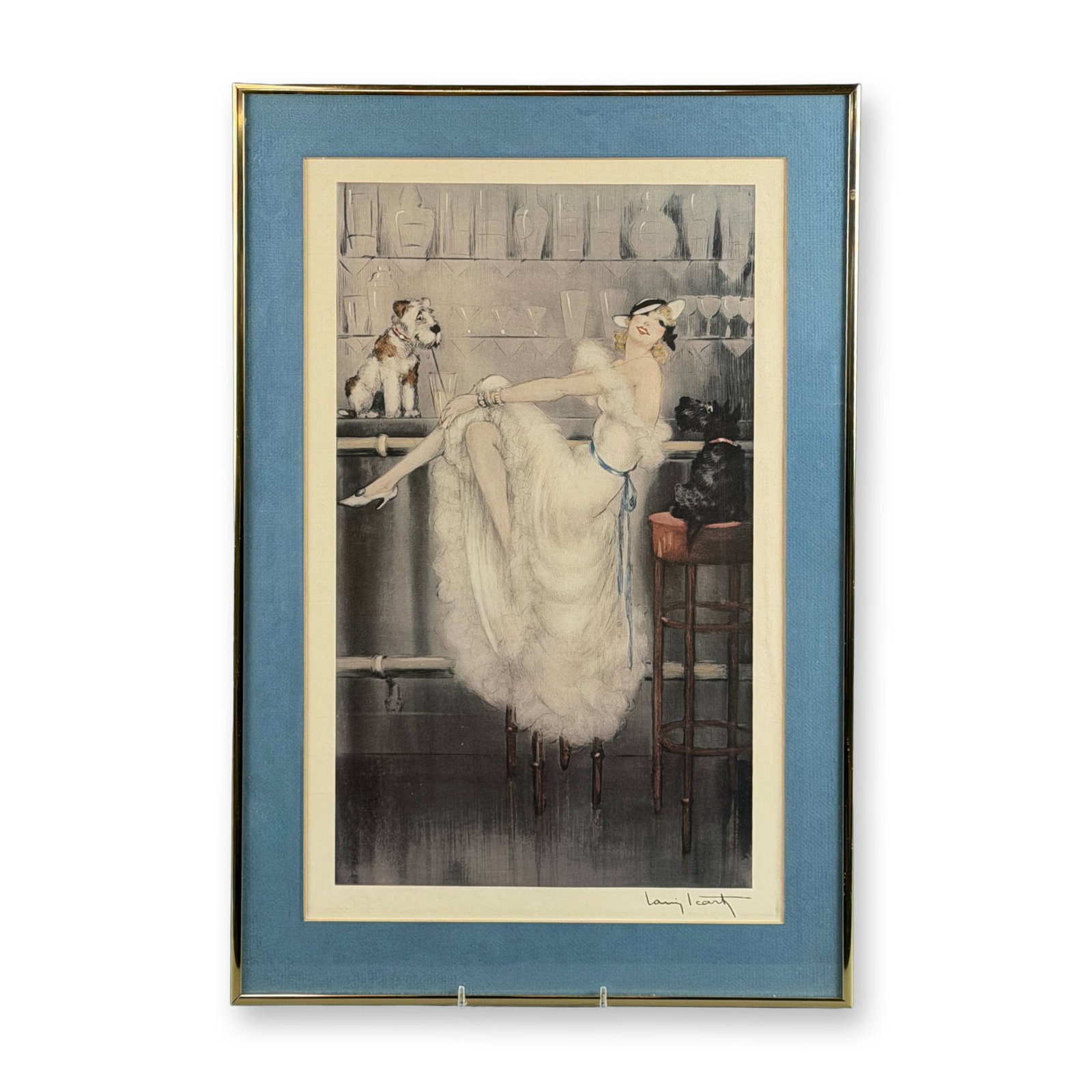 After Louis Icart (French, 1888-1950) Framed Print on Paper, Gay Trio: This Art Deco work by Louis Icart is titled Gay Trio. The composition depicts a woman in a ruffled white gown and a stylish hat seated at a bar, flanked by a wire-haired terrier and a black Scottish T