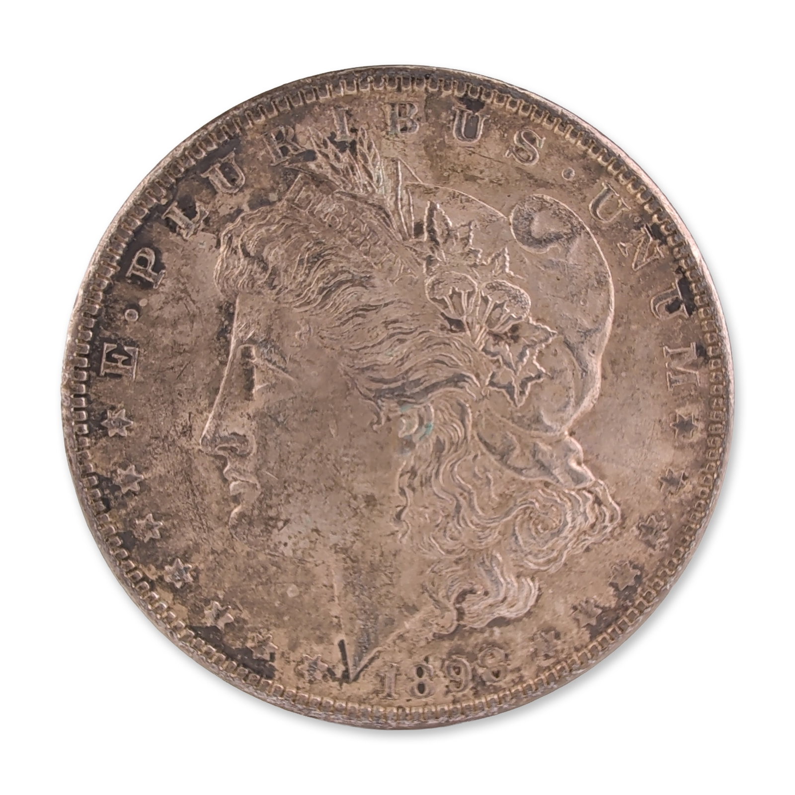 1898 US Morgan One Dollar Silver Coin, Circulated: 1898 US Morgan silver dollar. Struck at the Philadelphia Mint. Silver-colored metal composition. Standard Morgan obverse featuring the profile of Liberty and the motto E PLURIBUS UNUM. Reverse feature