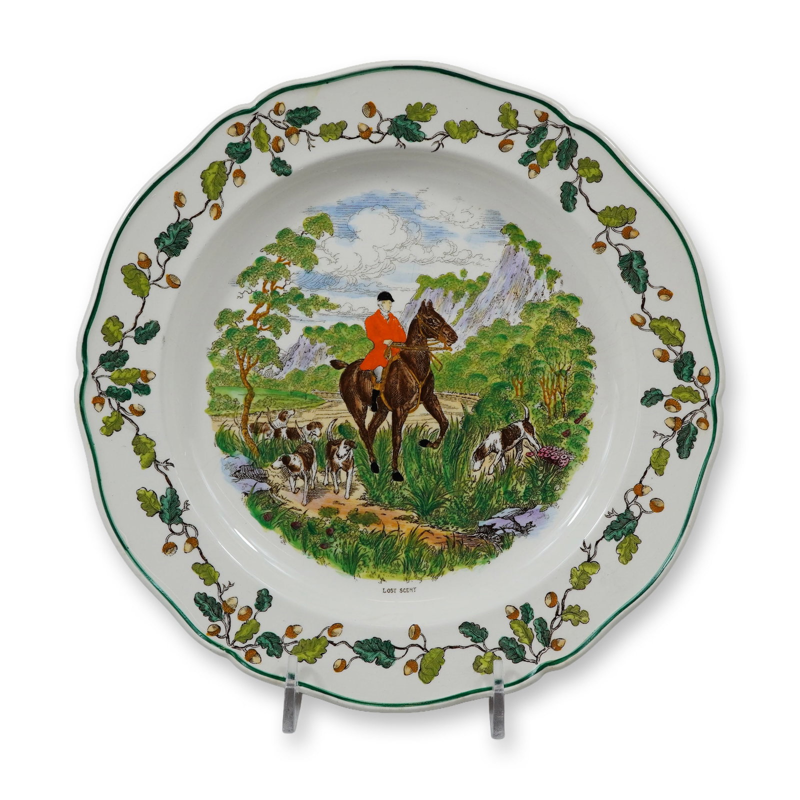 Wedgwood Etruria Meynell Hunt Pattern Plate Lost Scent: A Wedgwood earthenware plate from the Meynell Hunt series, featuring a central scene titled Lost Scent. This item was produced at the Etruria factory in England. The plate is designed with a scalloped