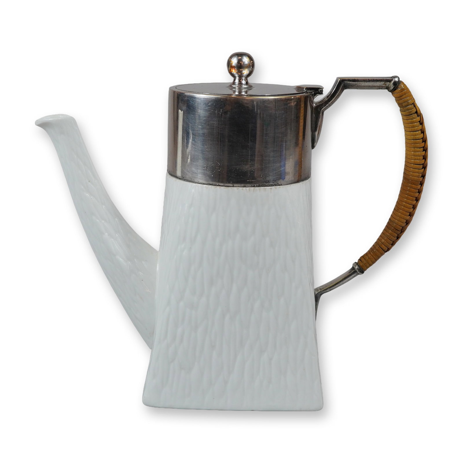 Wedgwood Ceramic Coffee Pot with Wicker Handle: This is a white ceramic coffee pot made by Wedgwood in England. It has a tapered, square-shaped body with an all-over molded textured surface resembling bark or stylized foliage. The pot features a si