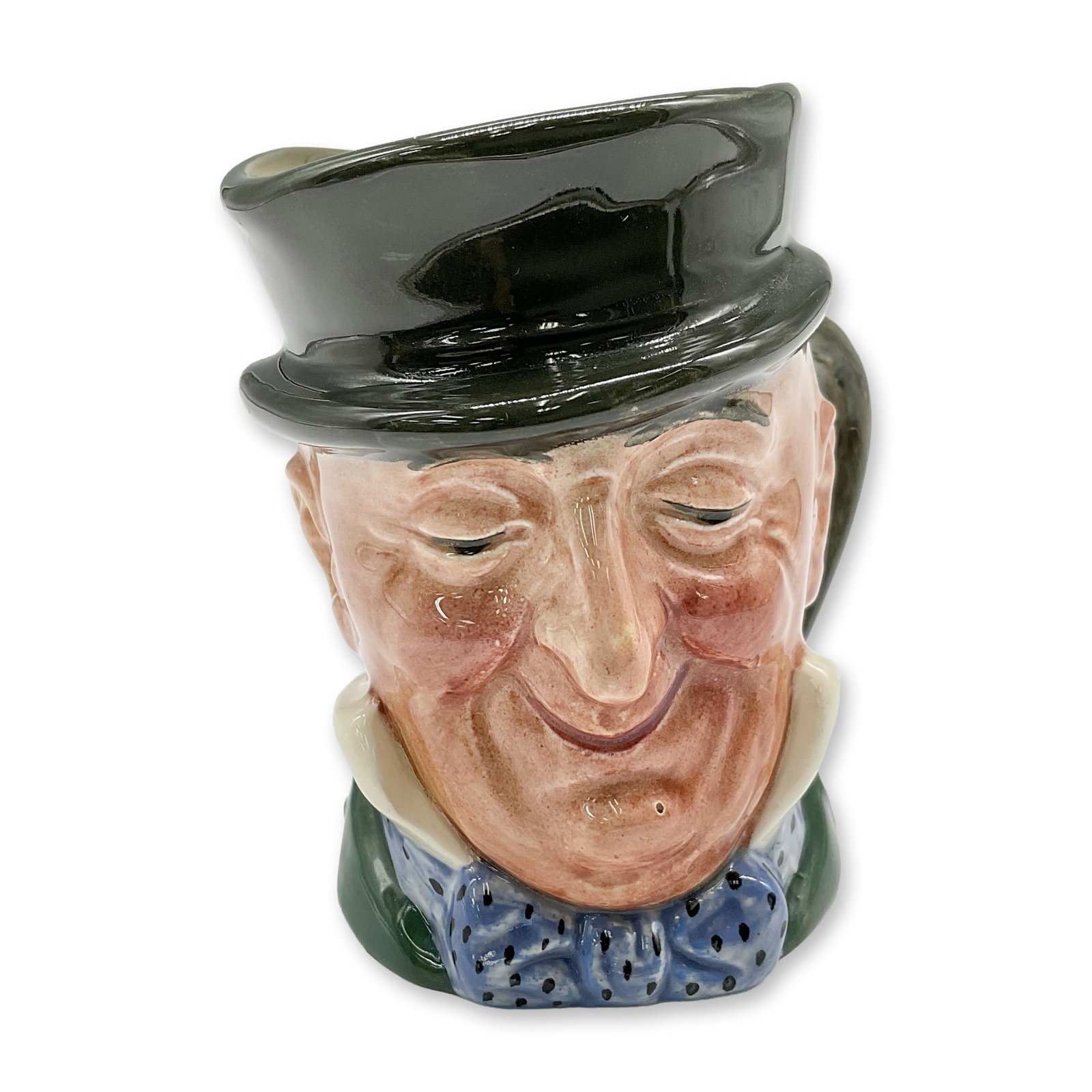 Mr. Micawber D5843 - Small - Royal Doulton Character Jug: Black hat; green coat; blue polka-dot bow tie. Royal Doulton backstamp. Artist: Leslie Harradine and Harry Fenton Dimensions: 3.25"H Date or Era: 1948 - 1960 Manufacturer or Brand: Royal Doulton C