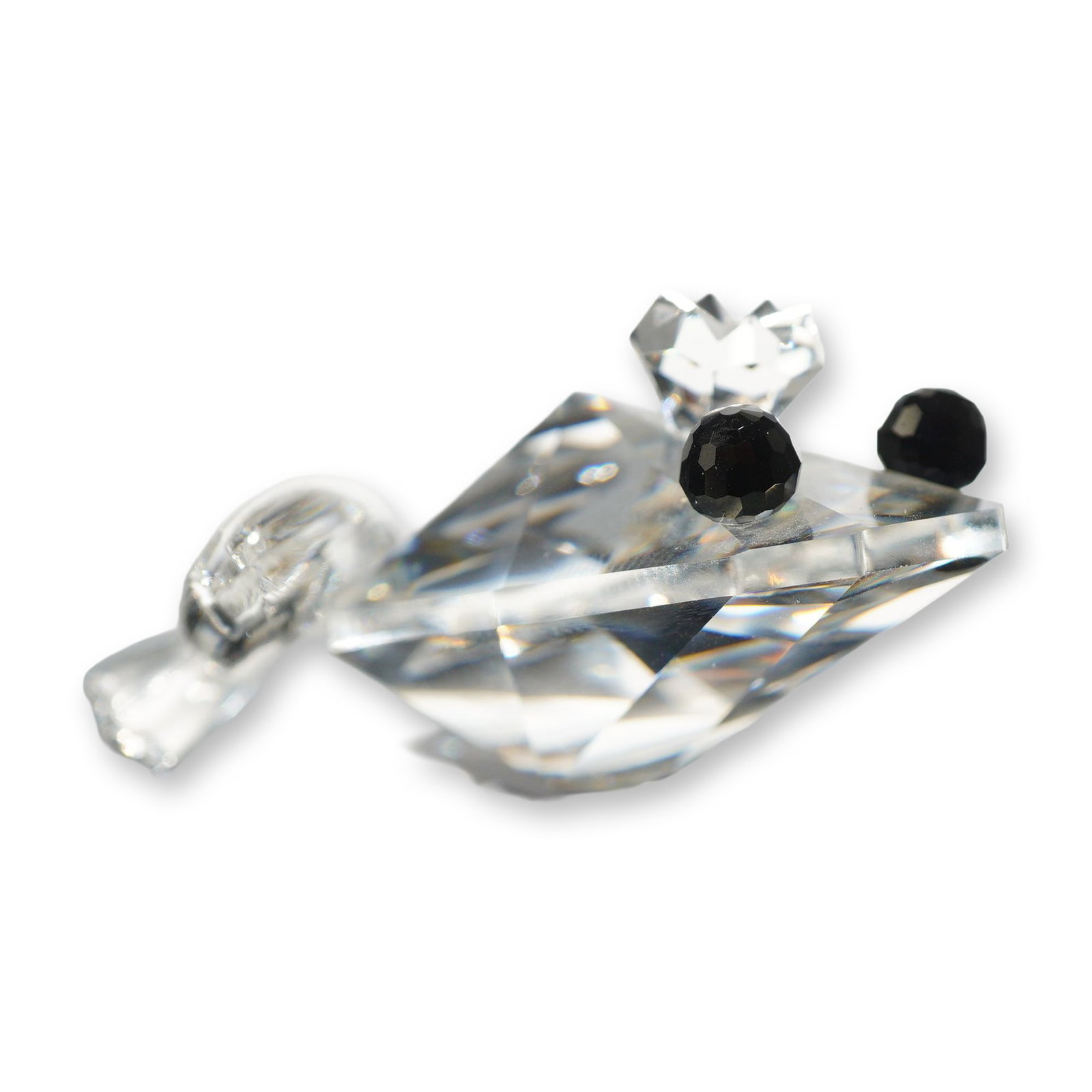Swarovski Crystal Frog Prince Figurine: Swarovski Silver Crystal figurine depicting the Frog Prince. The piece features a faceted clear lead crystal body, a faceted clear crystal crown on the head, and two small faceted black crystal eyes, 