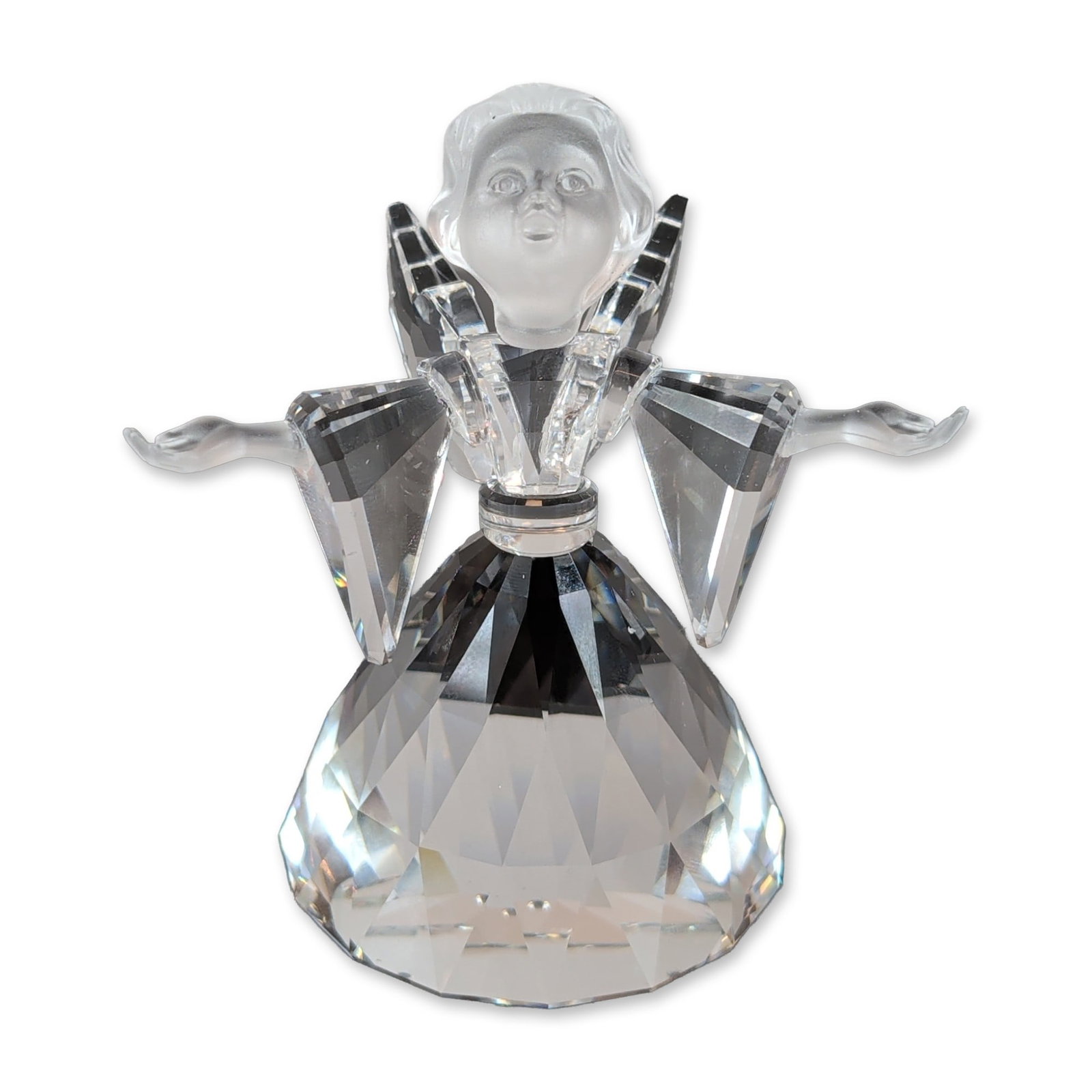 Swarovski Silver Crystal Angel Figurine: Swarovski Silver Crystal figurine, model number 194761, depicting an angel from the Cheerful Times series. The piece is constructed with a clear faceted lead crystal body and wings, accented by a fros