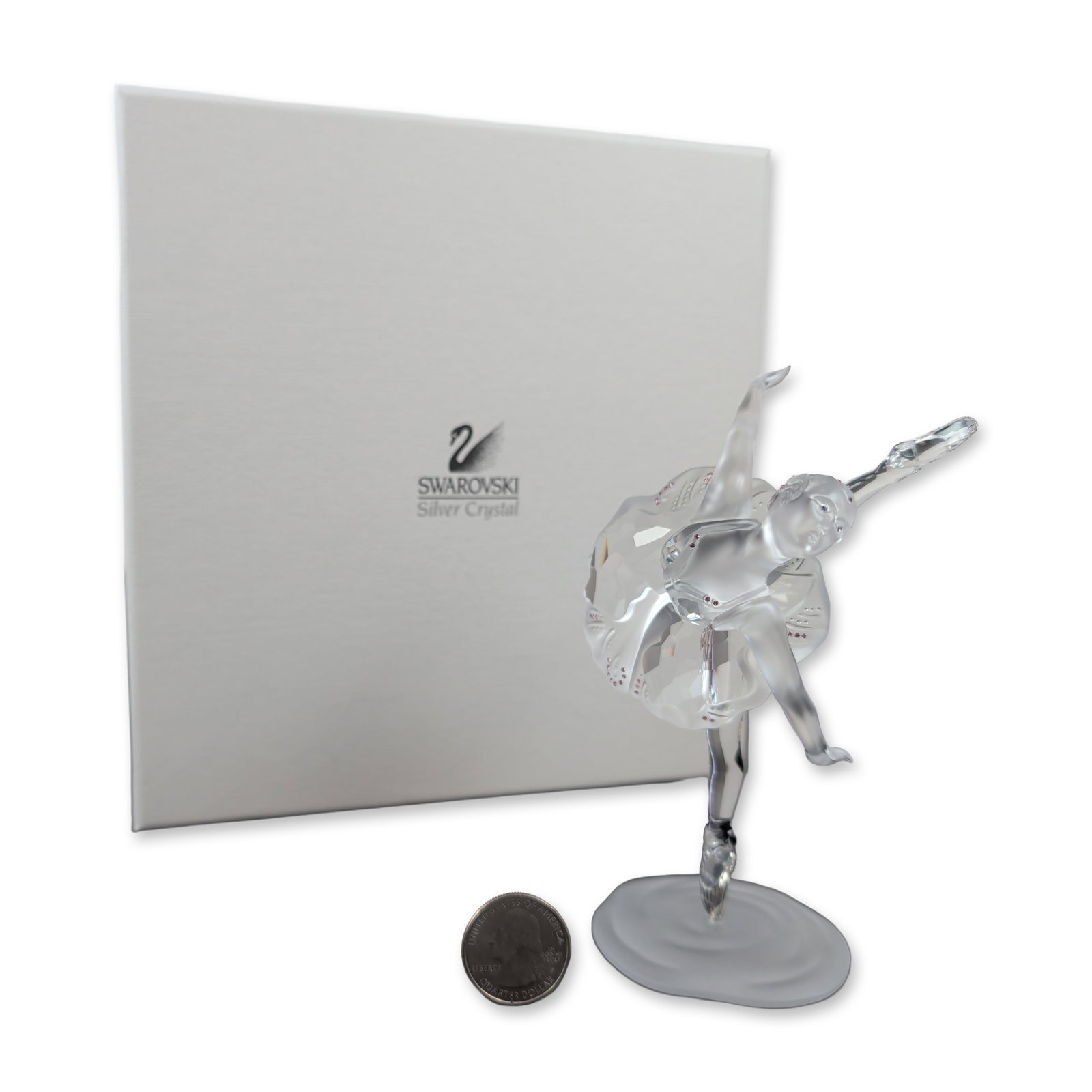 Swarovski Crystal Ballerina Figurine: This exquisite Swarovski crystal ballerina figurine from the Silver Crystal collection features a faceted clear crystal body and tutu, accented with frosted crystal on the head, hands, and pointe shoe