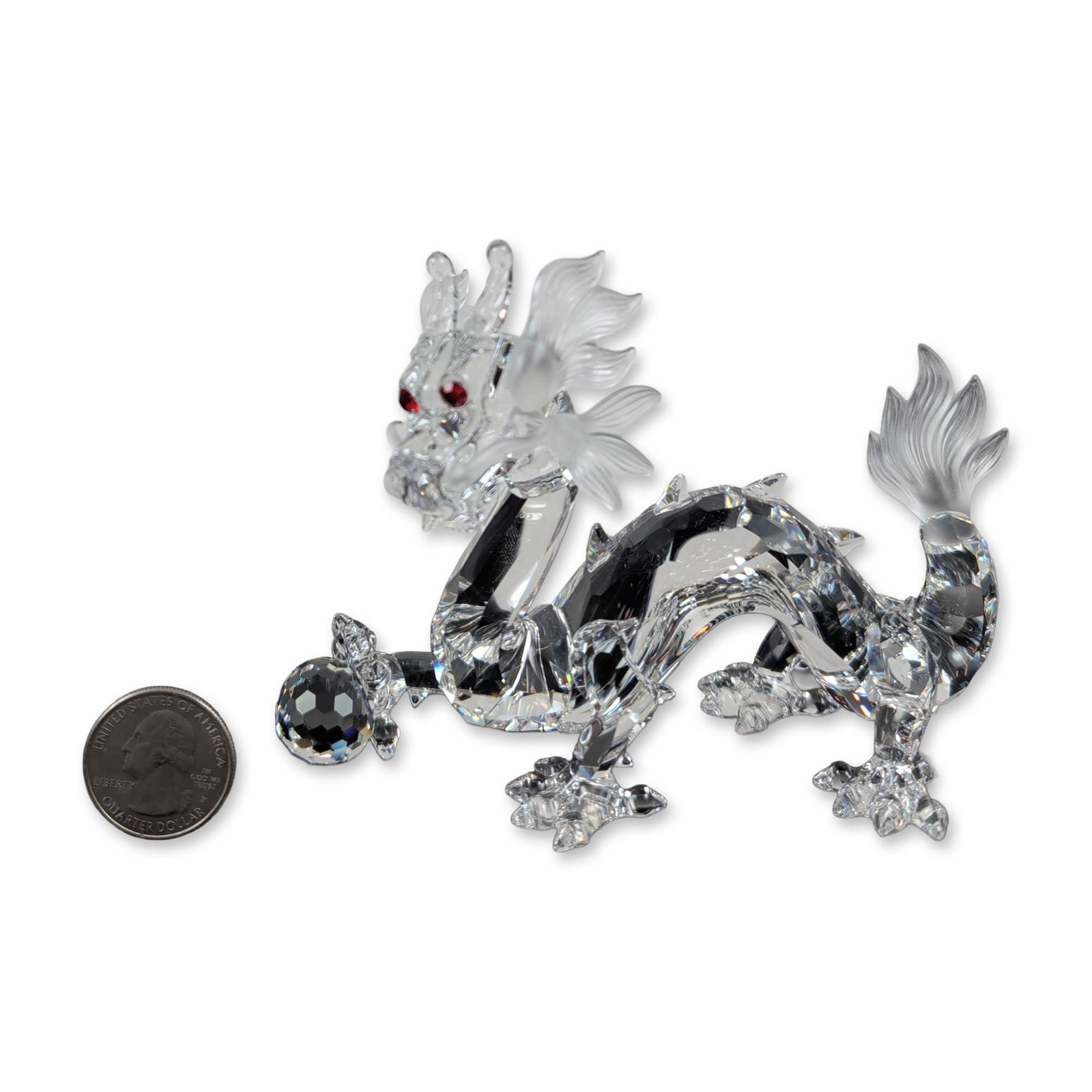 Swarovski 1997 SCS Crystal Fabulous Creatures Dragon Figurine: The Swarovski Crystal Society Annual Edition figurine, titled The Dragon from the Fabulous Creatures trilogy, is a stunning masterpiece. Expertly crafted in faceted clear lead crystal with frosted acc