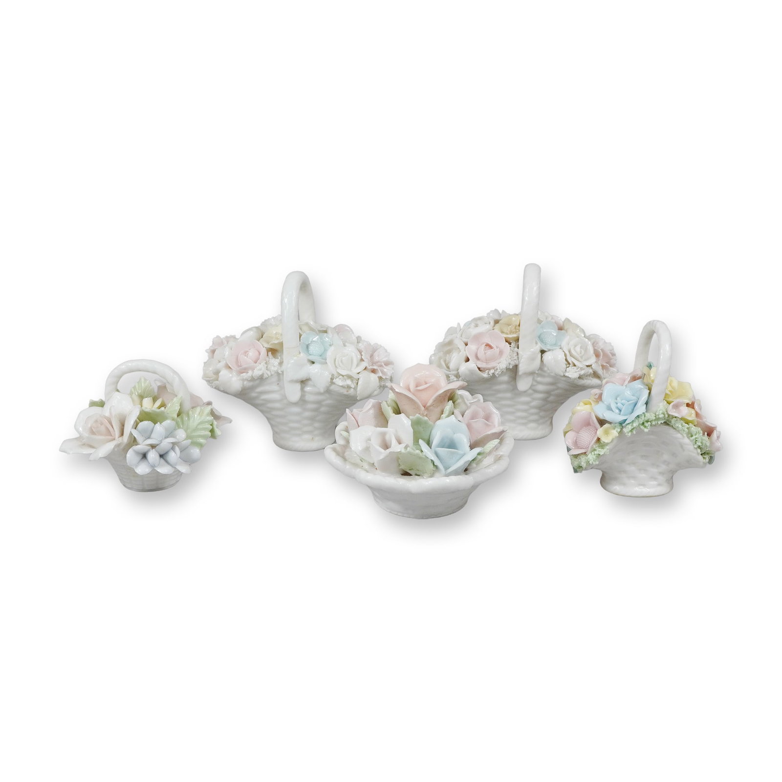5pc Porcelain Flower Baskets Including a Perfume Bottle: This lot consists of five miniature porcelain floral arrangements, including four handled baskets with molded basketweave textures and one perfume bottle. Each piece is decorated with hand-modeled