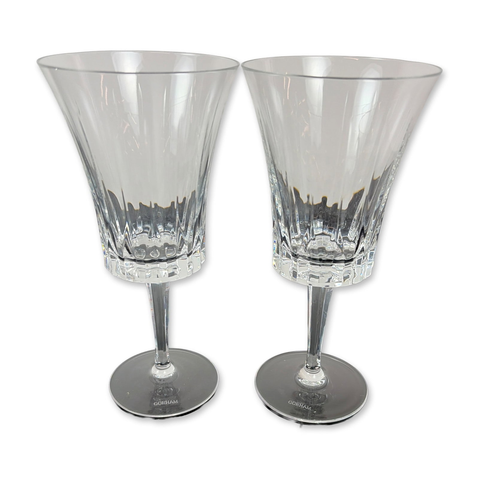 Pair of Gorham Richelieu-Rondo Crystal Water Goblet: Pair of stemmed glasses in Richelieu-Rondo pattern lead crystal, featuring flared bowls with vertical flute cuts and faceted lower sections above multi-faceted stems. Each etched GORHAM to underside o