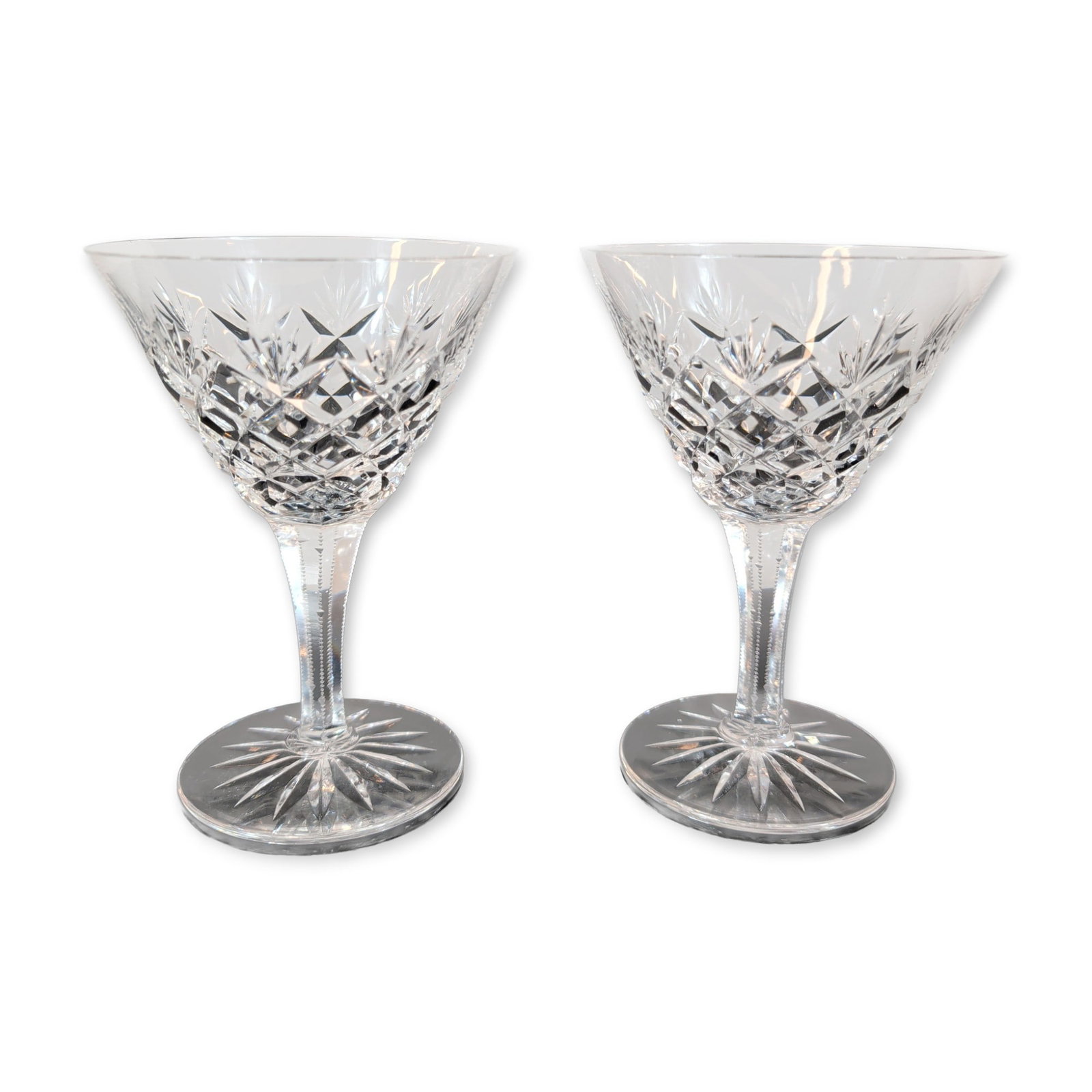Pair of Crystal Wine Glasses: Pair of wine glasses, featuring lead crystal construction with a band of diamond-cut cross-hatching and vertical wedge-cut fans. Each glass includes a multi-faceted stem with a central knop and a