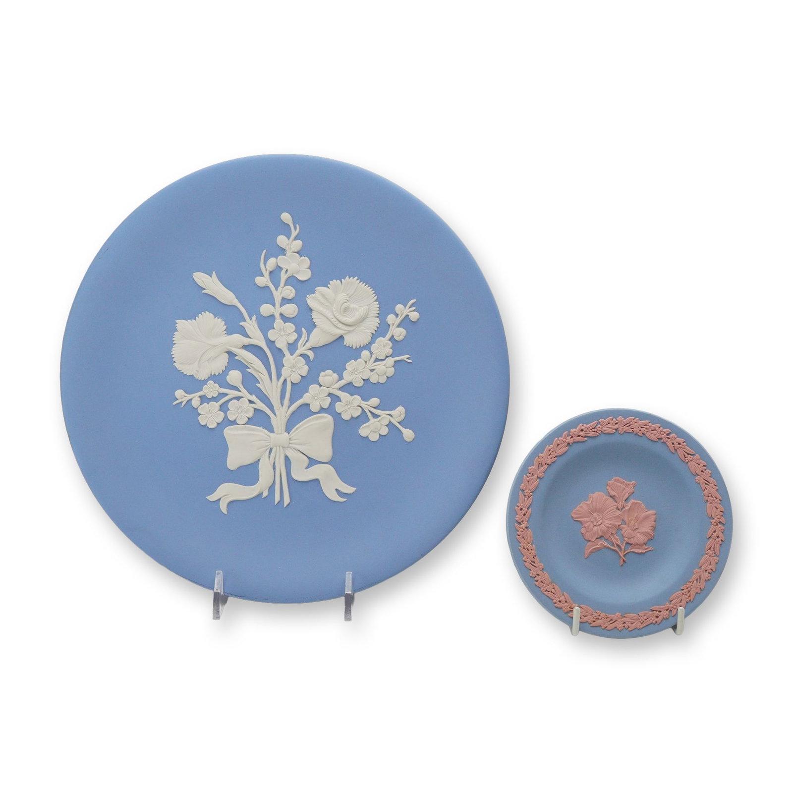 2 Wedgwood Blue Jasperware Plates Including Limited Edition Miniature Desert Rose Plate: This lot consists of two pieces of Wedgwood jasperware stoneware produced in England. The first item is a large circular display plate in pale blue jasper with white bas-relief sprigged decoration. Th