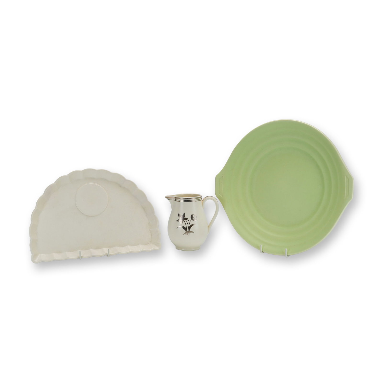 3pc Wedgwood Moonstone and April Green Ceramic Tableware Pieces: This lot consists of three pieces of Wedgwood earthenware, including designs by Keith Murray and items from the April Green line. The first item is a Keith Murray scalloped snack plate in a crescent f