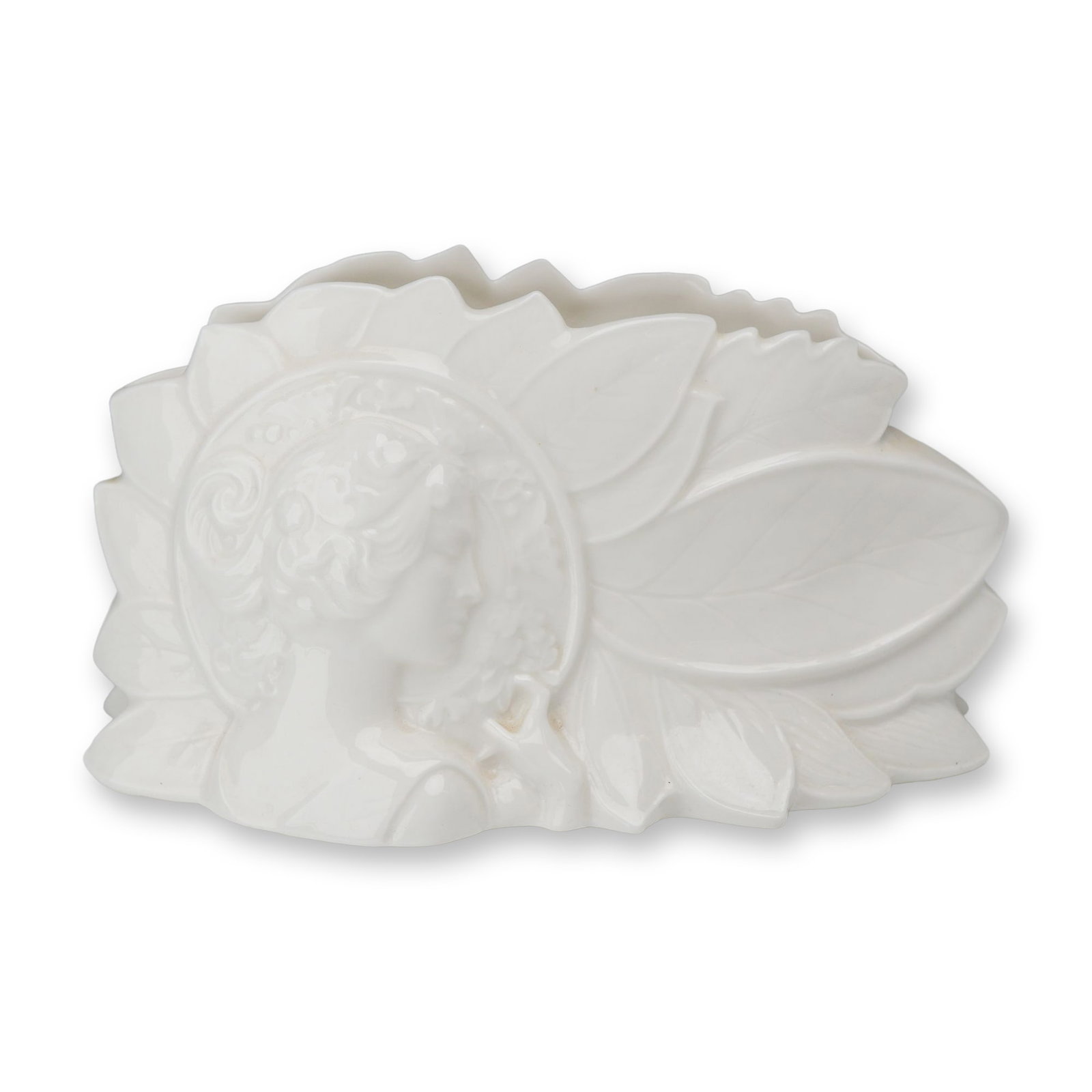 Wedgwood for Compton and Woodhouse The John Bromley Silhouette Vase: This is a low, fan-shaped pocket vase manufactured in England by Wedgwood for Compton and Woodhouse. Designated as The John Bromley Silhouette Vase, the piece is crafted from fine white porcelain with