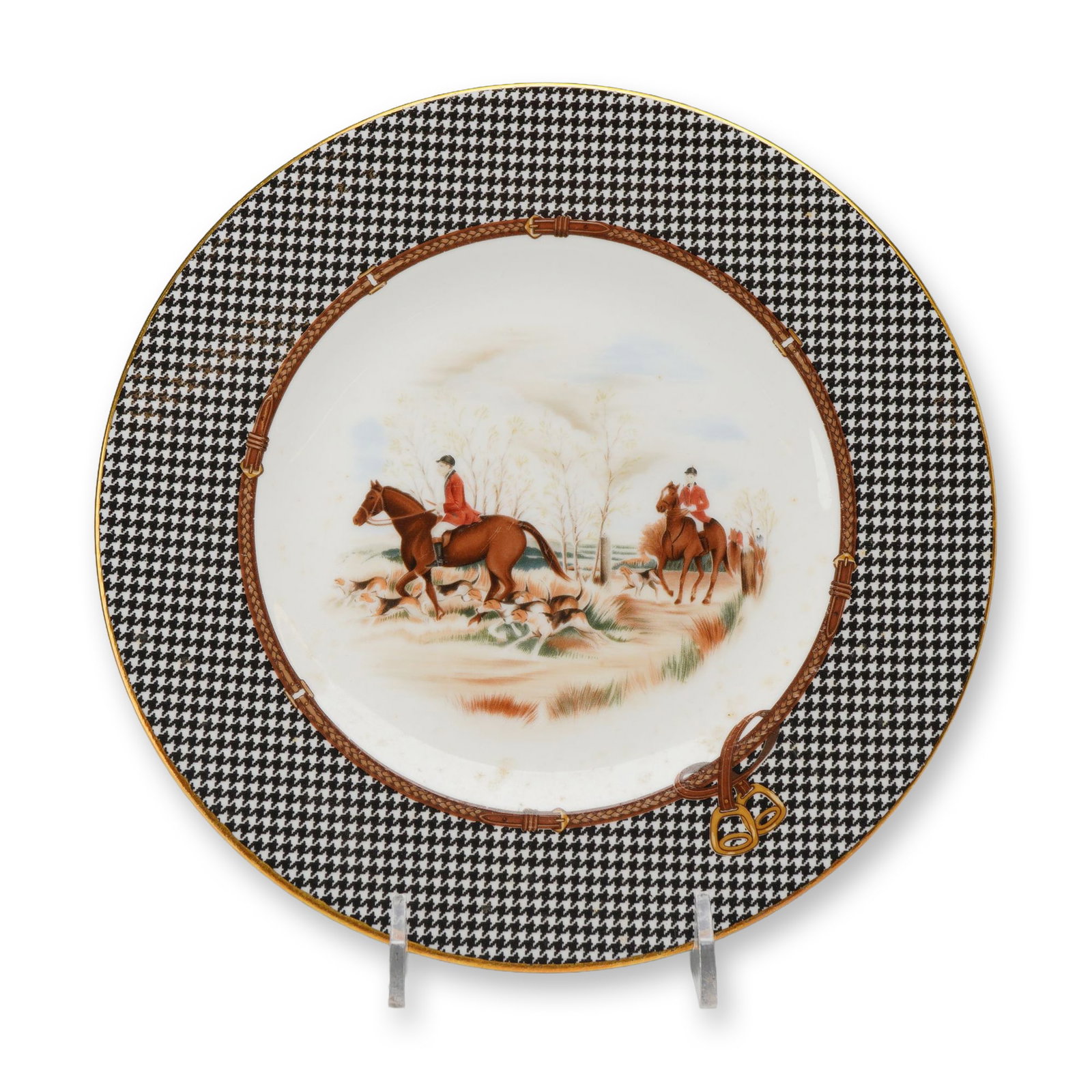 Wedgwood Ralph Lauren Berkshire Hunt Bone China Plate: This bone china plate was manufactured by Wedgwood for Ralph Lauren as part of the Berkshire Hunt collection. The circular plate features a wide border decorated with a black and white houndstooth pat