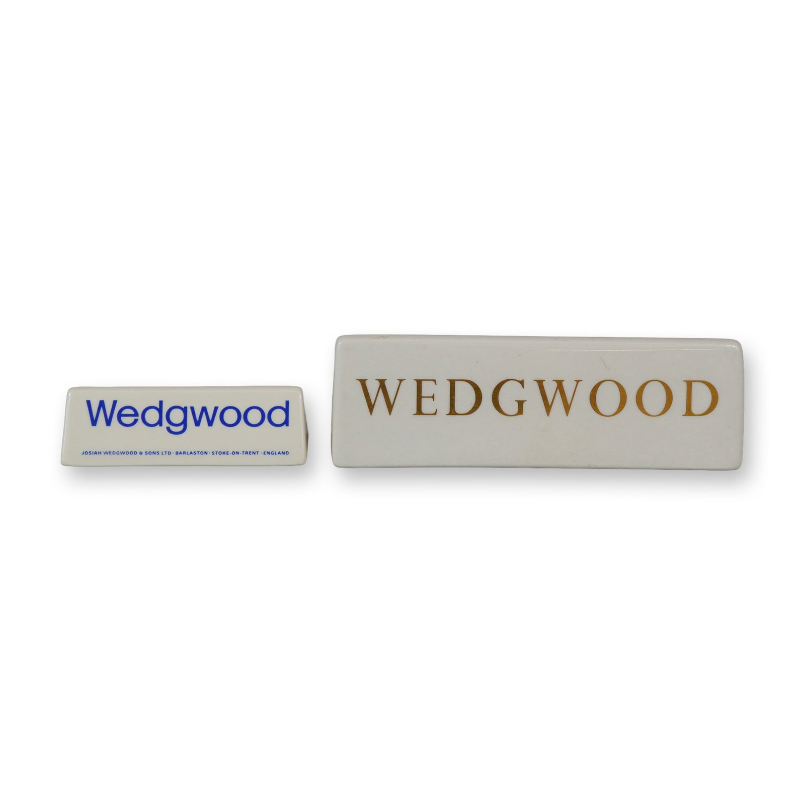 Two Josiah Wedgwood & Sons Ceramic Advertising Dealer Display Signs: This lot consists of two retail display signs manufactured by Josiah Wedgwood and Sons Ltd. for use in a showroom or dealer setting. Both items are fashioned from white glazed ceramic. The smaller sig
