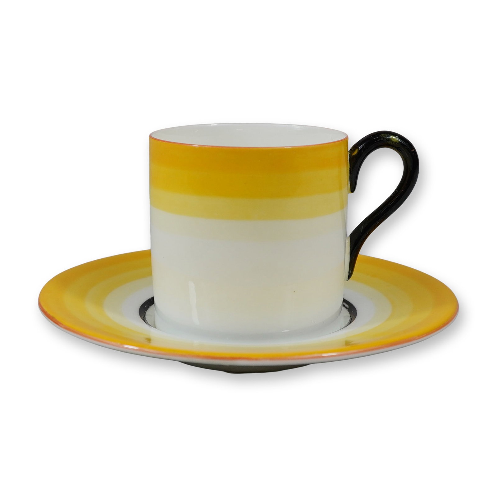 2pc Wedgwood Art Deco Bone China Demitasse Cup and Saucer: A Wedgwood bone china demitasse cup and saucer produced in the Art Deco style, circa 1930. The set features a cylindrical cup with a solid black glazed scrolled handle. Both the cup and the saucer are