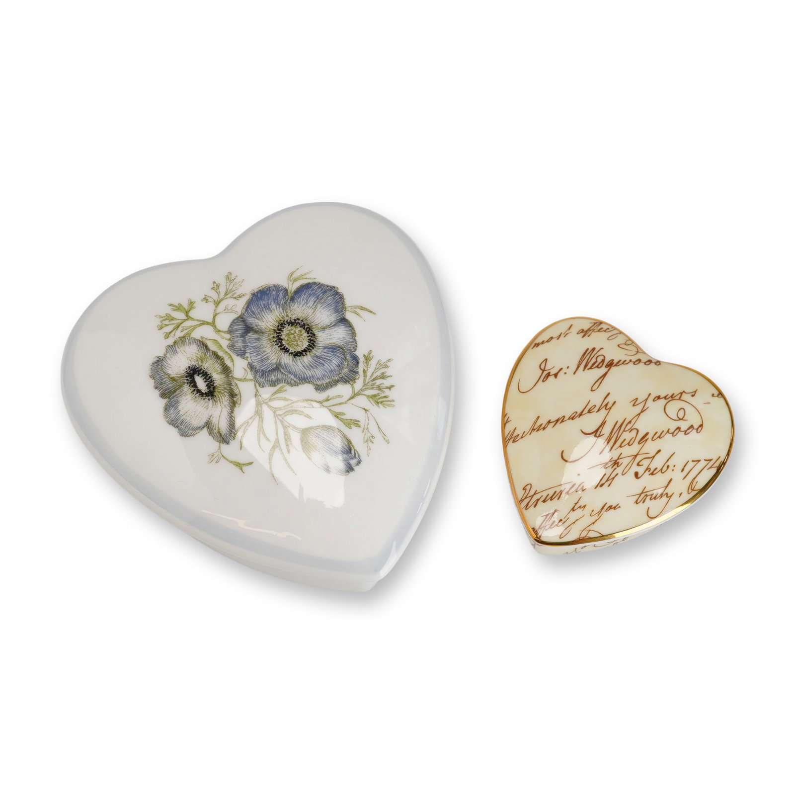 2pc Wedgwood Bone China Heart Shaped Trinket Boxes: This lot consists of two heart-shaped Wedgwood bone china lidded trinket boxes, each retaining a gray Rubin Collection sticker on the base. The larger box features the Susie Cooper "Glen Mist" pattern