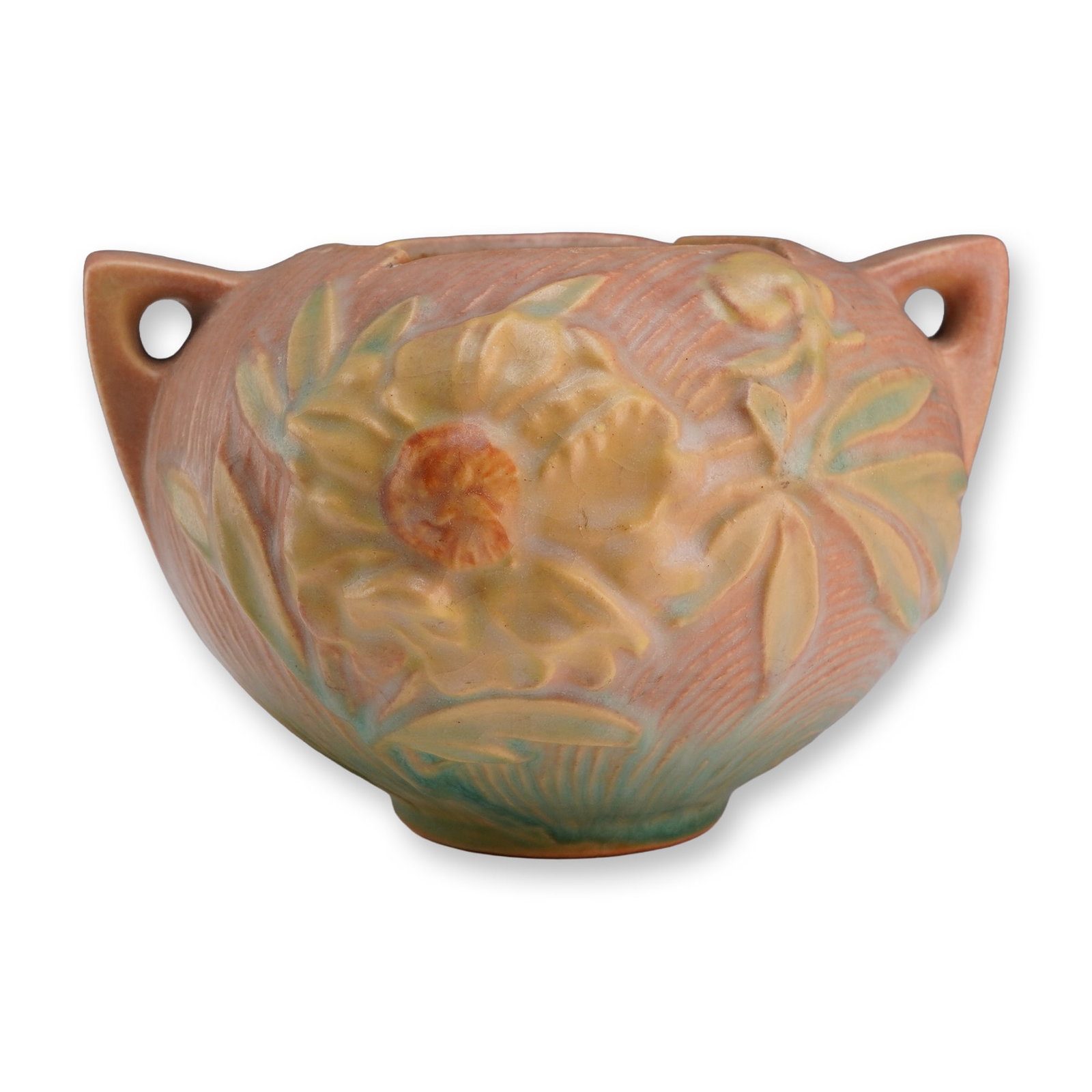 Roseville Pottery Peony Pattern Two-Handled Coral Pink and Green Rose Bowl 427-4: A glazed earthenware bowl vase produced by Roseville Pottery in the Peony pattern, which was introduced in 1942. The vessel features a bulbous form with two integral, angular handles located at the ri