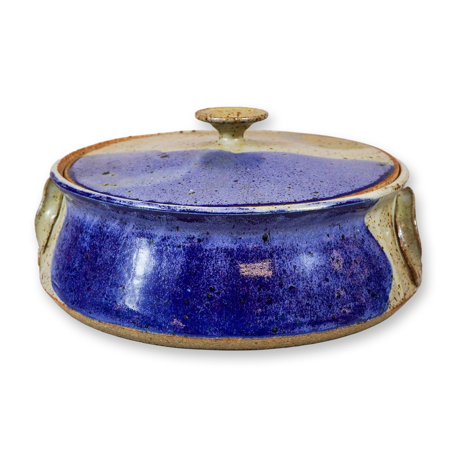 Studio Pottery Lidded Stoneware Casserole Dish: This hand-made studio pottery lidded casserole dish is constructed from stoneware with a wheel-thrown circular body and two applied handles. The piece features a variegated glaze design consisting of 