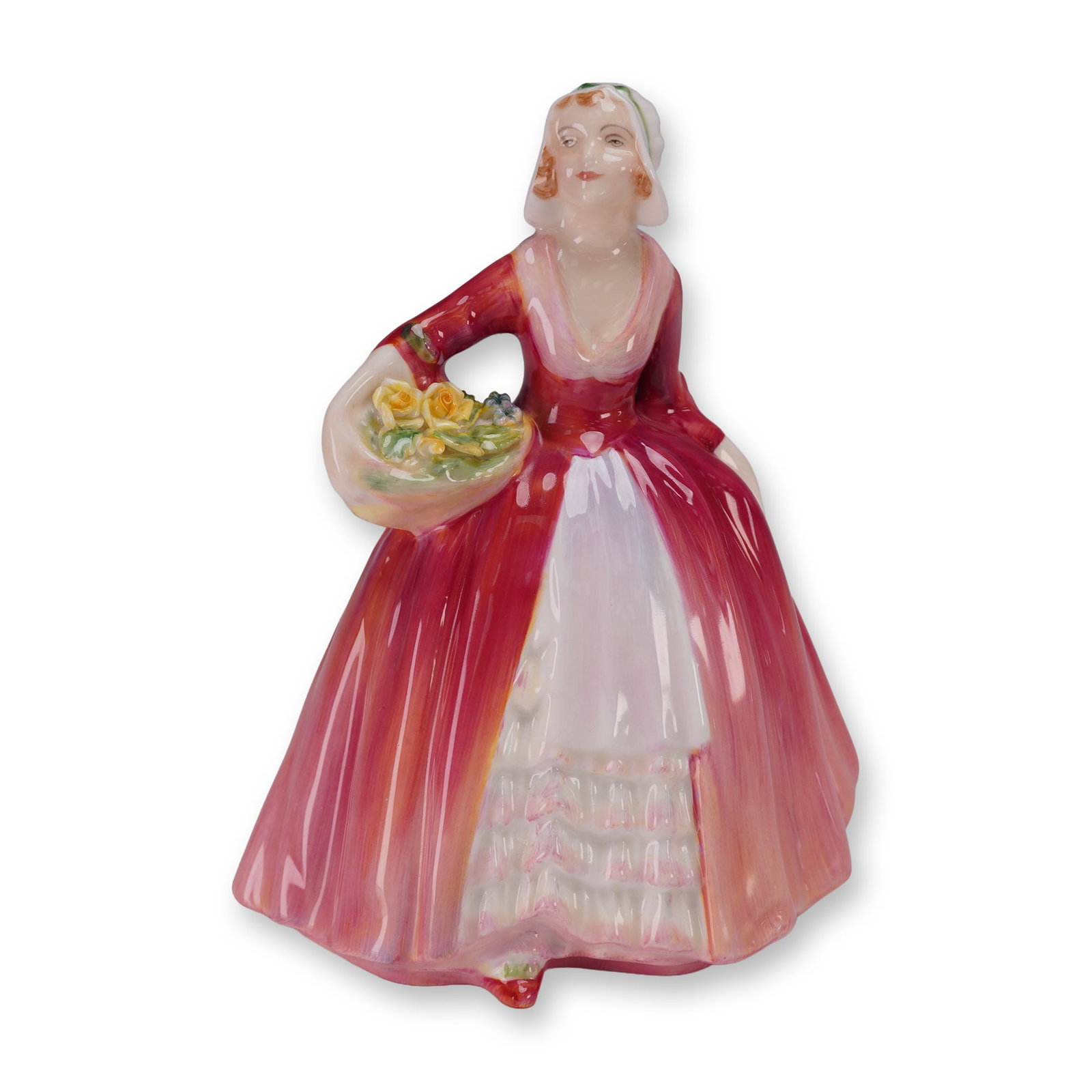 Royal Doulton Figurine, Janet HN1537: A Royal Doulton porcelain figurine titled Janet HN1537, issued in 1932, designed by Leslie Harradine. The figure depicts a young woman in a flowing deep rose and pink dress with white apron, holding a