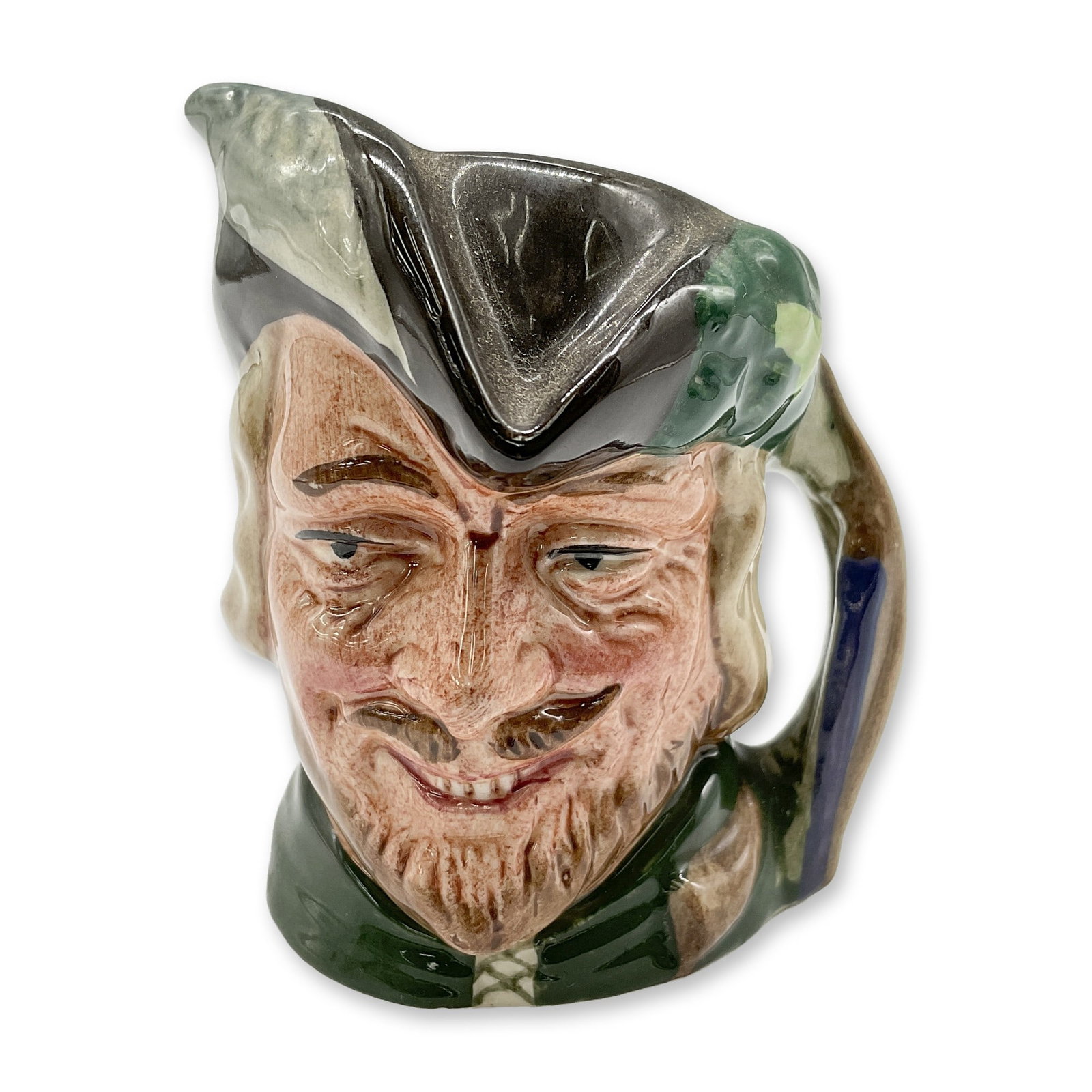 Robin Hood D6541 - Mini - Royal Doulton Character Jug: Style Two. Brown hat with white feather on one side and oak leaves and acorns on the other; green robes. Royal Doulton backstamp. Artist: Max Henk Dimensions: 2.75"H Date or Era: 1960 - 1991 Manufactu