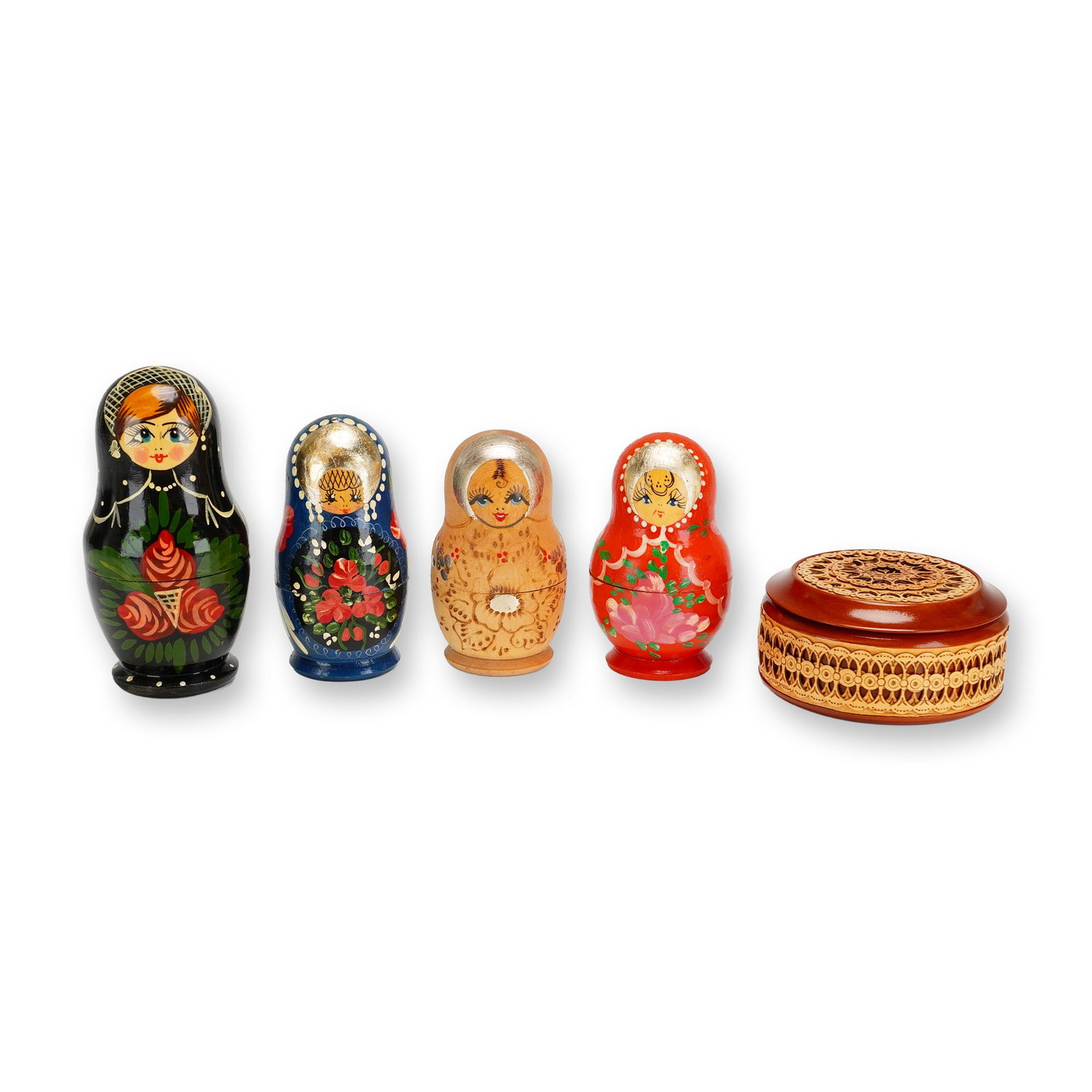 5pc Russian Matryoshka Nesting Dolls and a Lidded Box: This collection includes four traditional Russian Matryoshka nesting dolls and a circular lidded box. The first nesting set is crafted from wood with a glossy black ground, hand-painted with large red