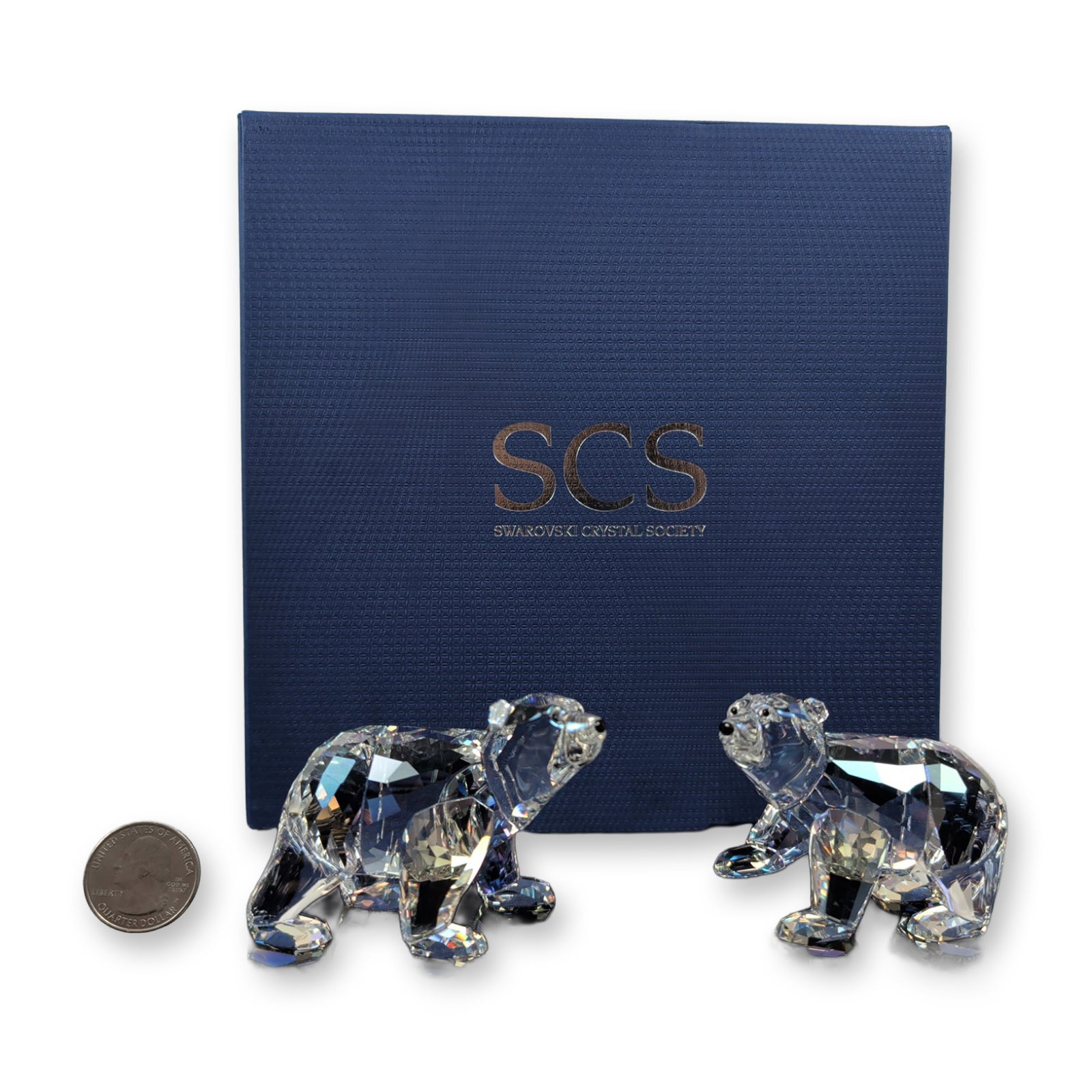 Swarovski SCS 2011 Annual Edition Crystal Figurines, Moonlight Polar Bear Cubs: This delightful pair of Polar Bear cubs, released exclusively in 2011, is crafted from stunning moonlight-colored crystal with jet-black eyes and noses. The figurines feature beautifully faceted clear