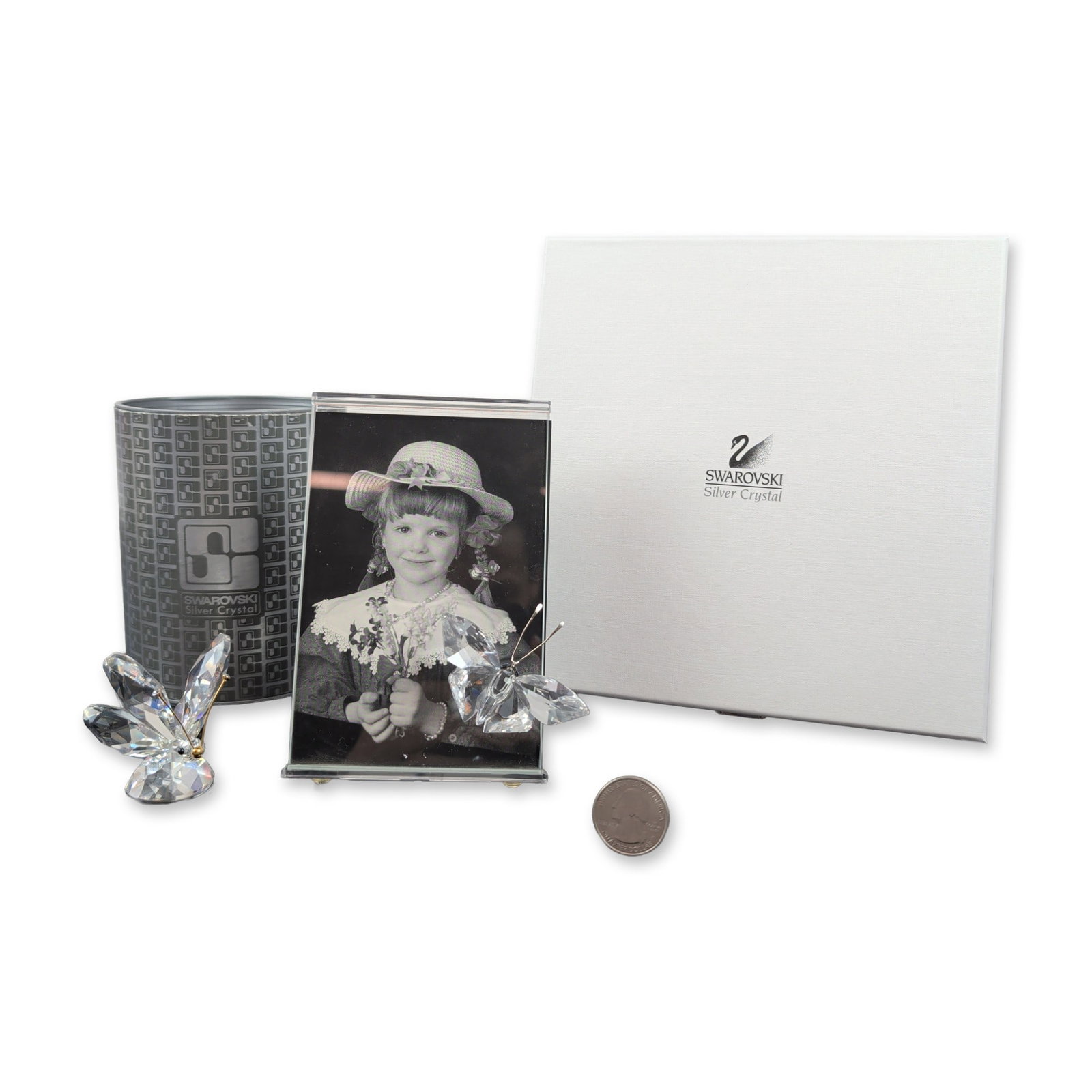2pc Swarovski Silver Crystal Collection, Frame and Butterfly Figurine: This collection features a faceted crystal butterfly figurine and a picture frame adorned with faceted crystal butterflies. The frame comes with a clear plastic folding stand embossed with the maker's